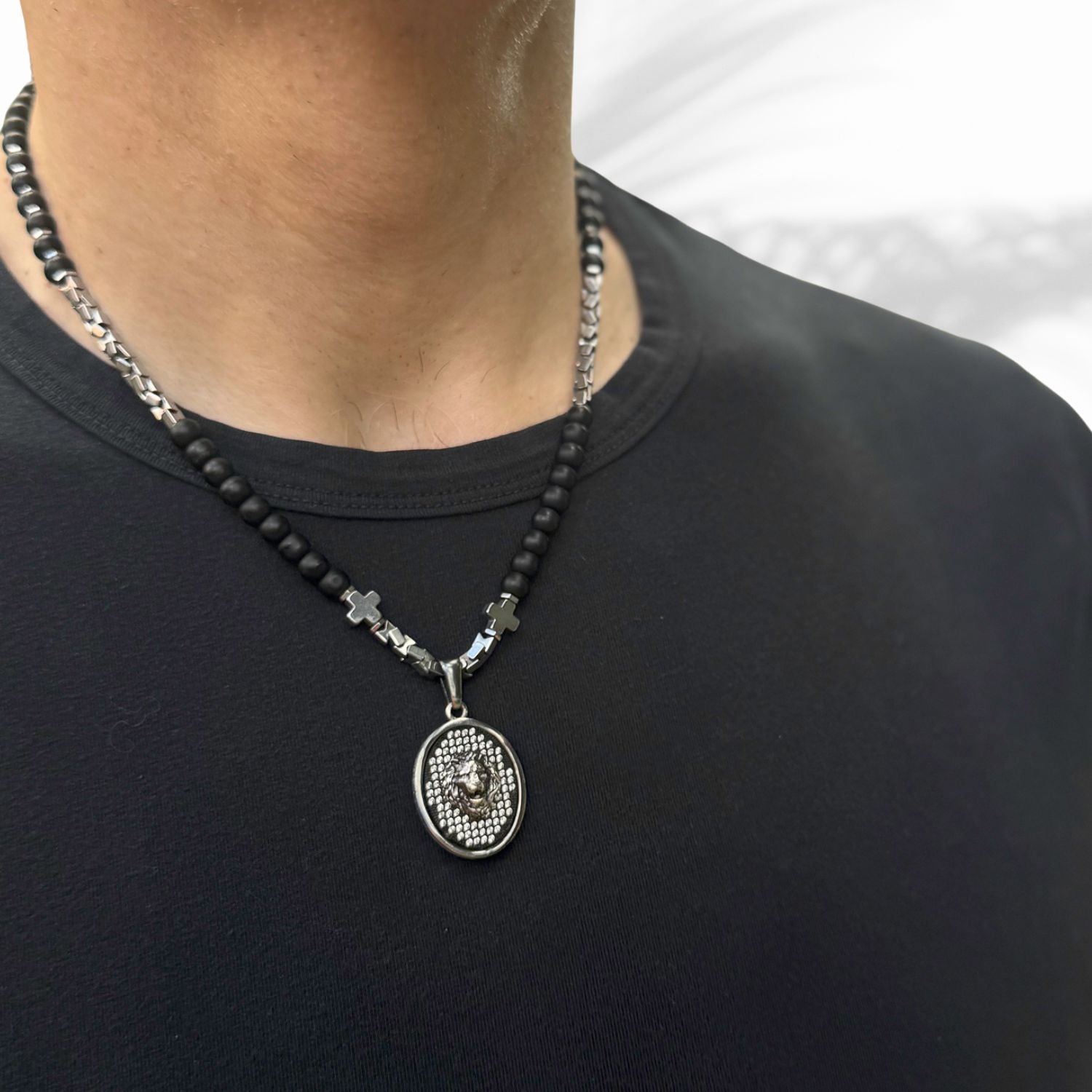Short black onyx men’s necklace with 925 silver lion pendant and Swarovski crystal eyes.