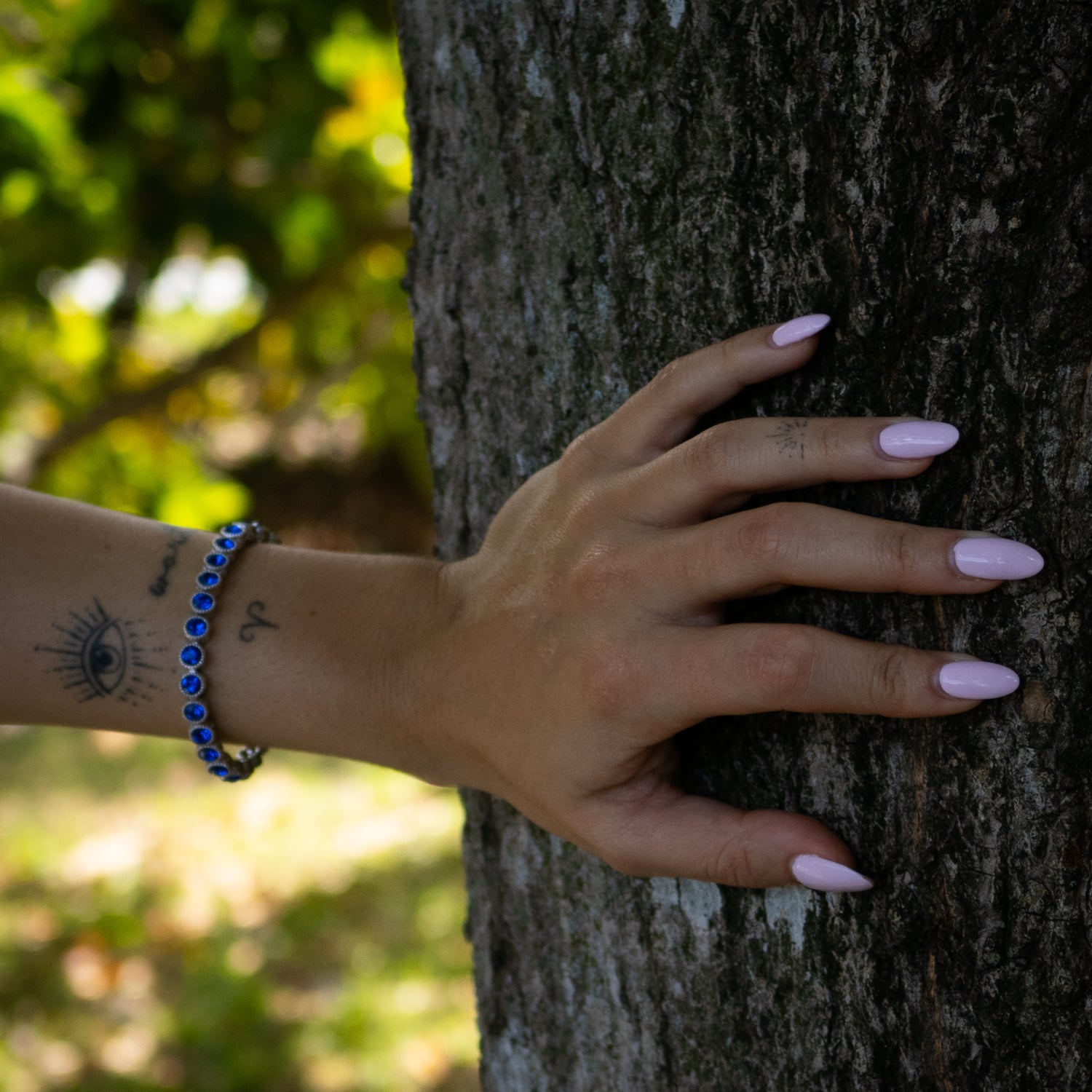 Silver-Plated Blue Sapphire Bracelet with Mystic Engravings, Representing Clarity and Protection