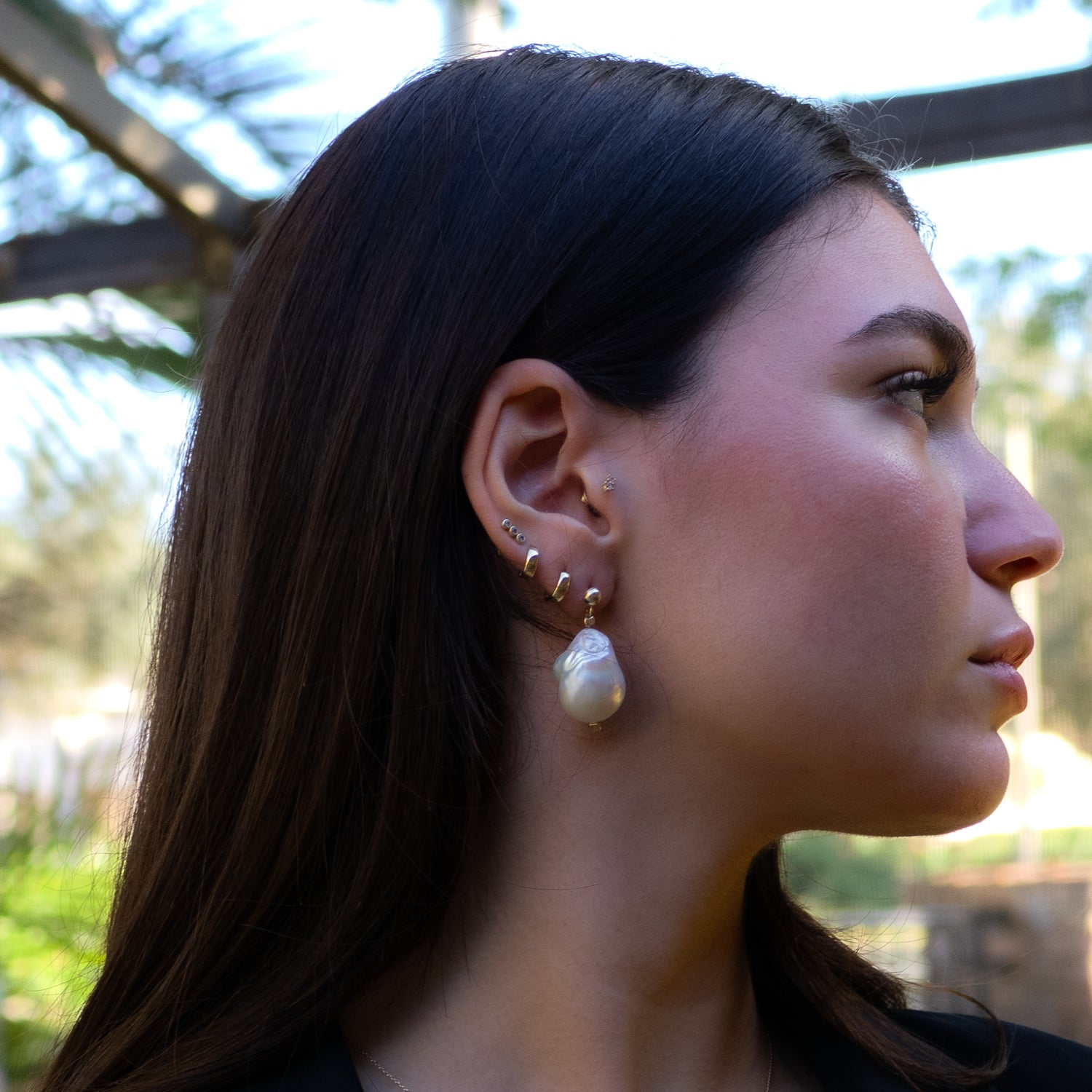 14K gold stud earrings featuring bold baroque pearls