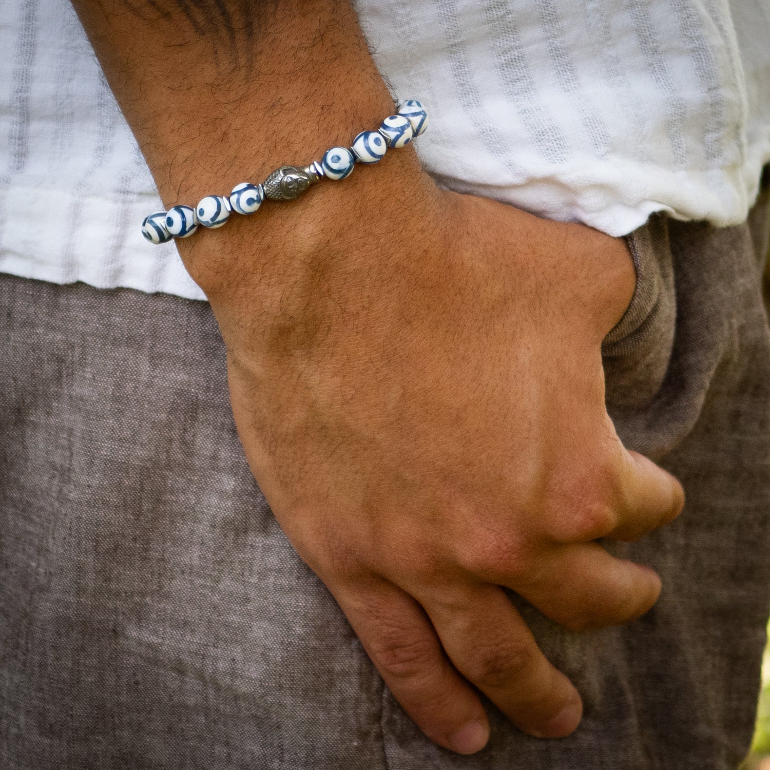 Handmade spiritual bracelet featuring silver Buddha bead and calming Nepal beads.