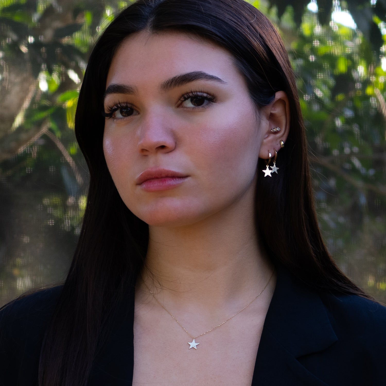 Handmade Celestial Grace earrings with star-shaped charms on yellow gold hoops