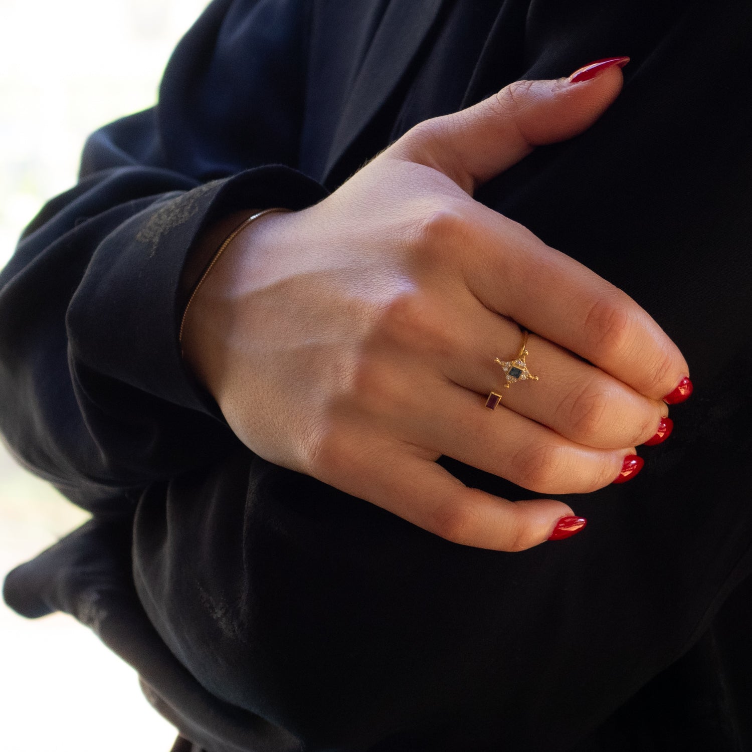 Elegant 14K gold ring with pink gemstone and sparkling star detail
