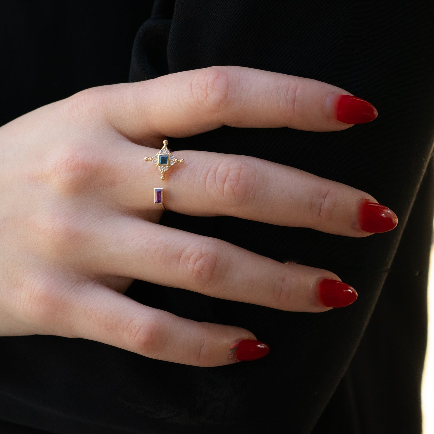 Celestial-inspired gold ring featuring pink and blue sapphire gemstones