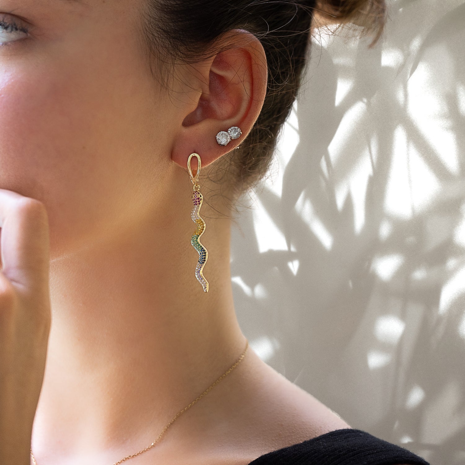 Model wearing the Cheerful Snake Earrings, showcasing their playful and eye-catching design.