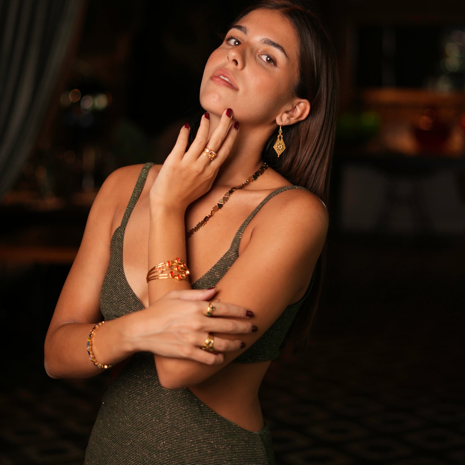 Luxurious 24k gold-plated cuff bracelet with a chunky design, featuring oval carnelian stones and five thin gold wires, adjustable size.