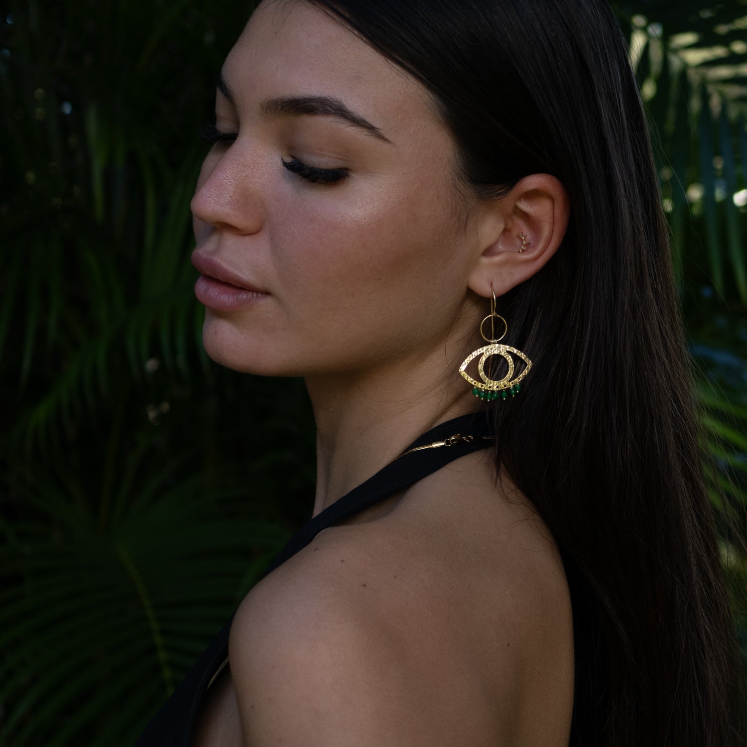 Handcrafted 925 sterling silver earrings plated with 18k gold, featuring green jade drops and Cleopatra eye design.
