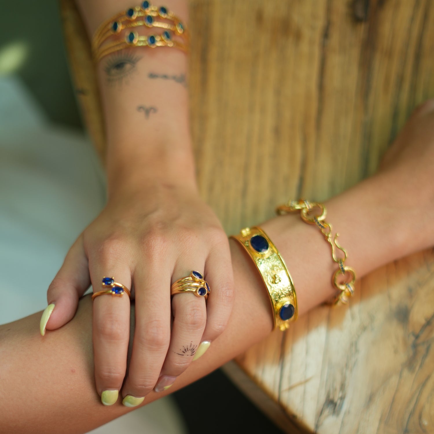Gold Cuff Bracelet with Sapphire Stones for a Bold, Chic Look with Timeless Appeal
