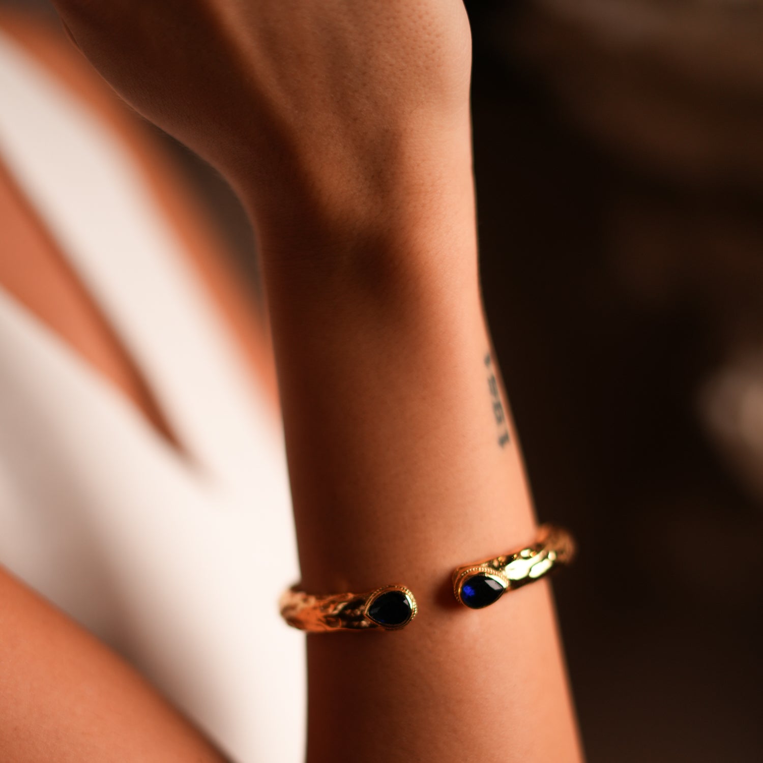 Handcrafted 24K Gold Cuff Bracelet with Teardrop Sapphire Stones for a Bold, Mystical Look