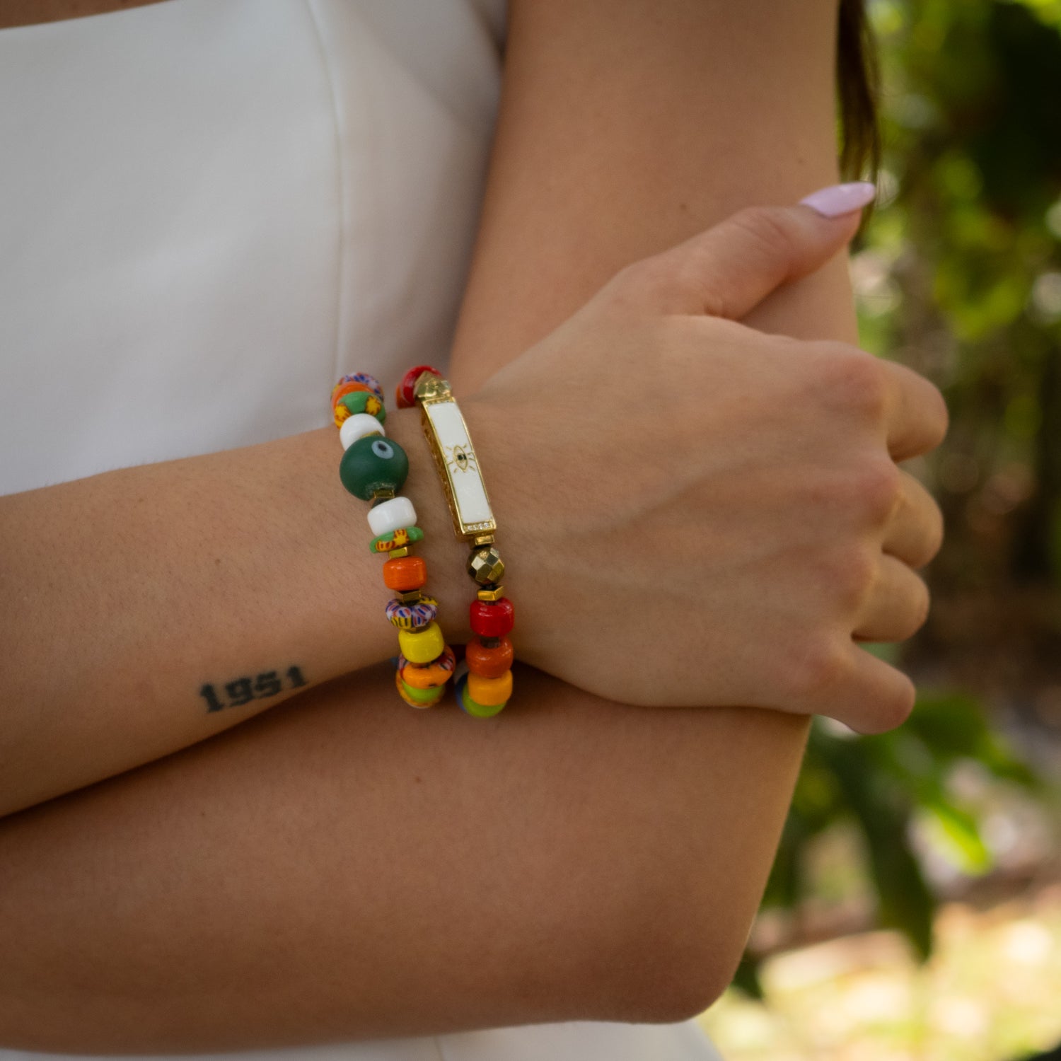 Handmade bracelet set with green evil eye charm and 18K gold plated white enamel evil eye bead