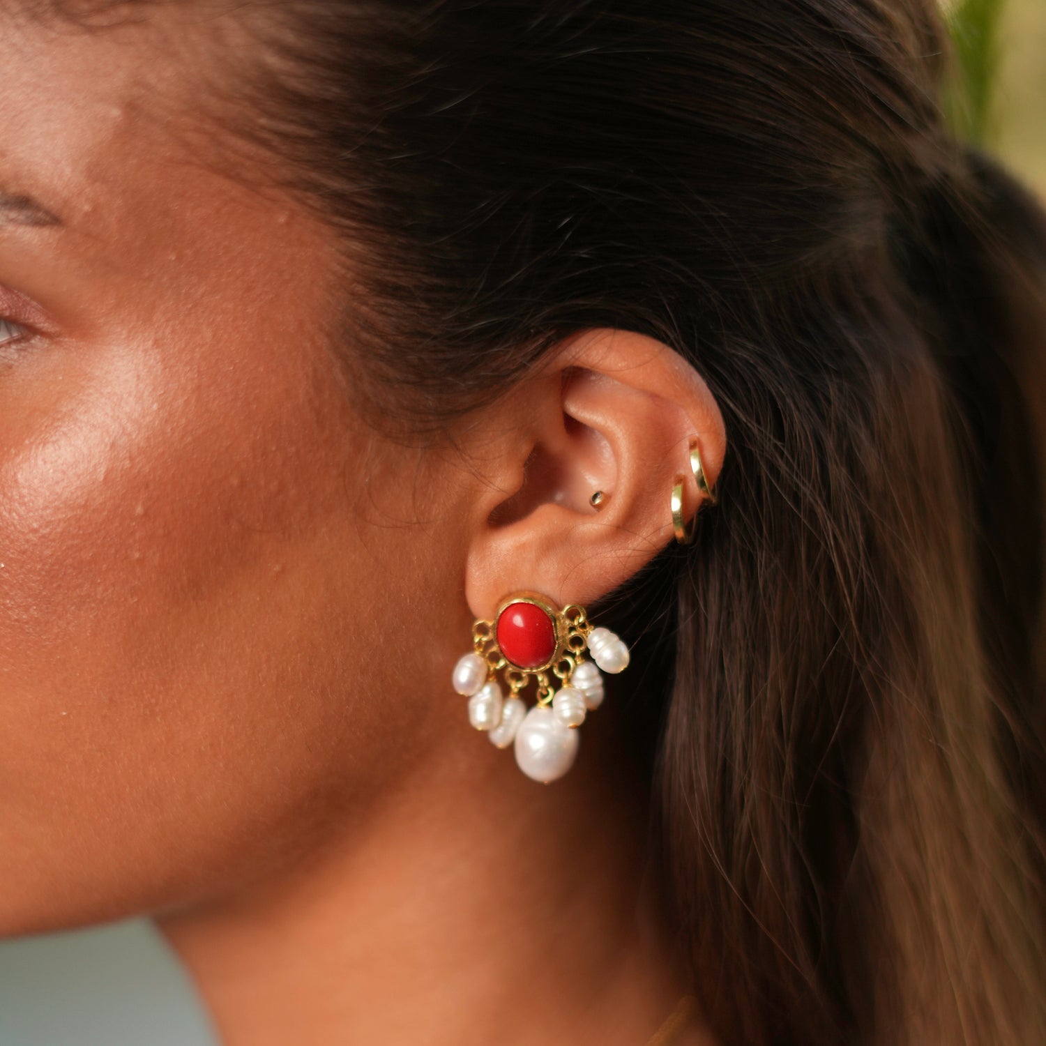 Elegant coral blossom earrings with pearl clusters, plated in 24k gold for a bold and sophisticated look.