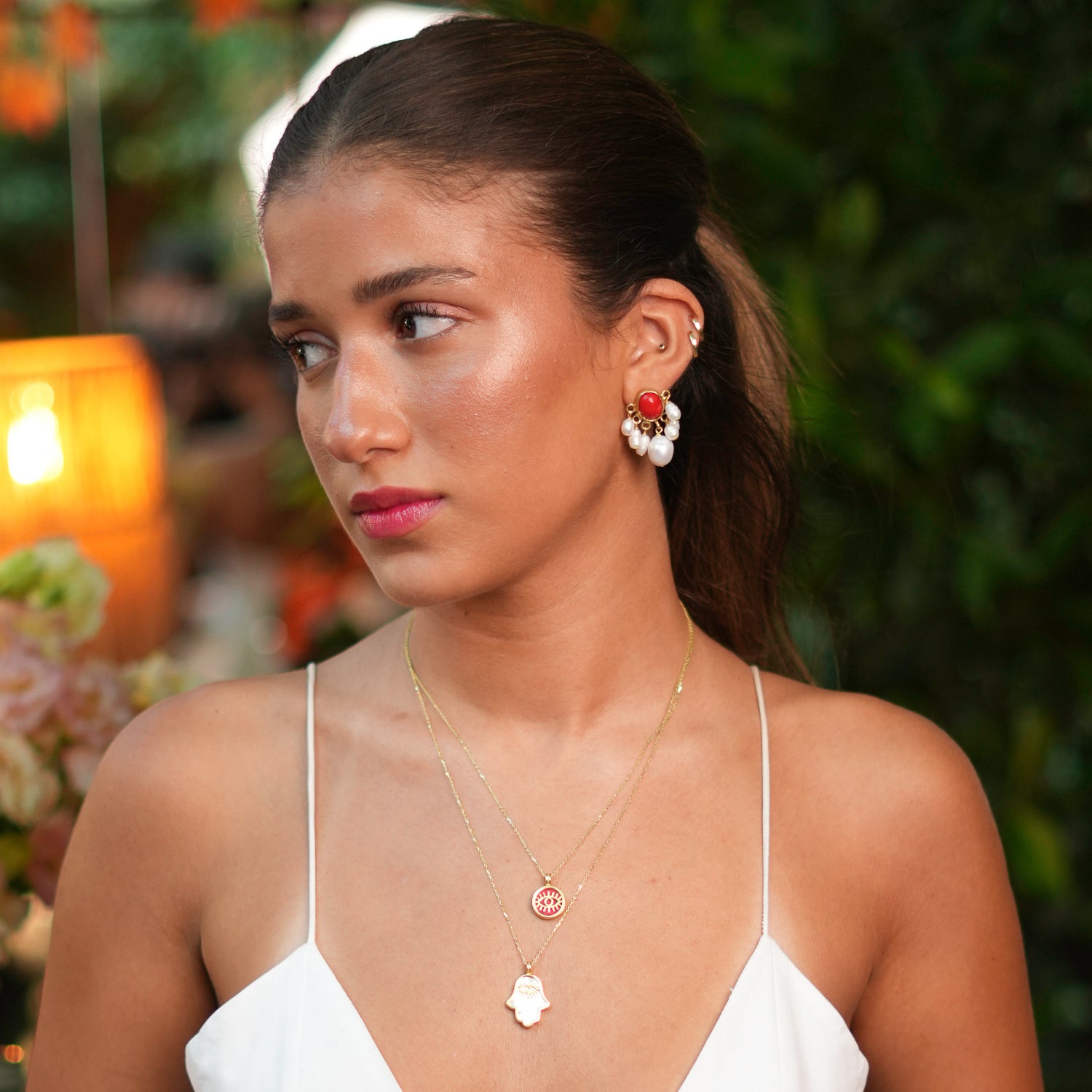 Unique coral blossom earrings with pearl accents, offering a blend of natural beauty and luxurious design.