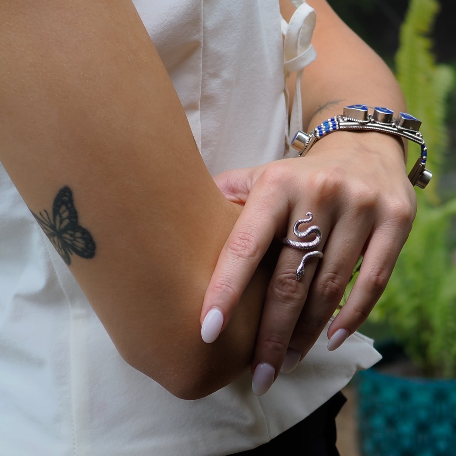 Timeless snake ring crafted in sterling silver, designed for adjustable wear and deep spiritual significance.