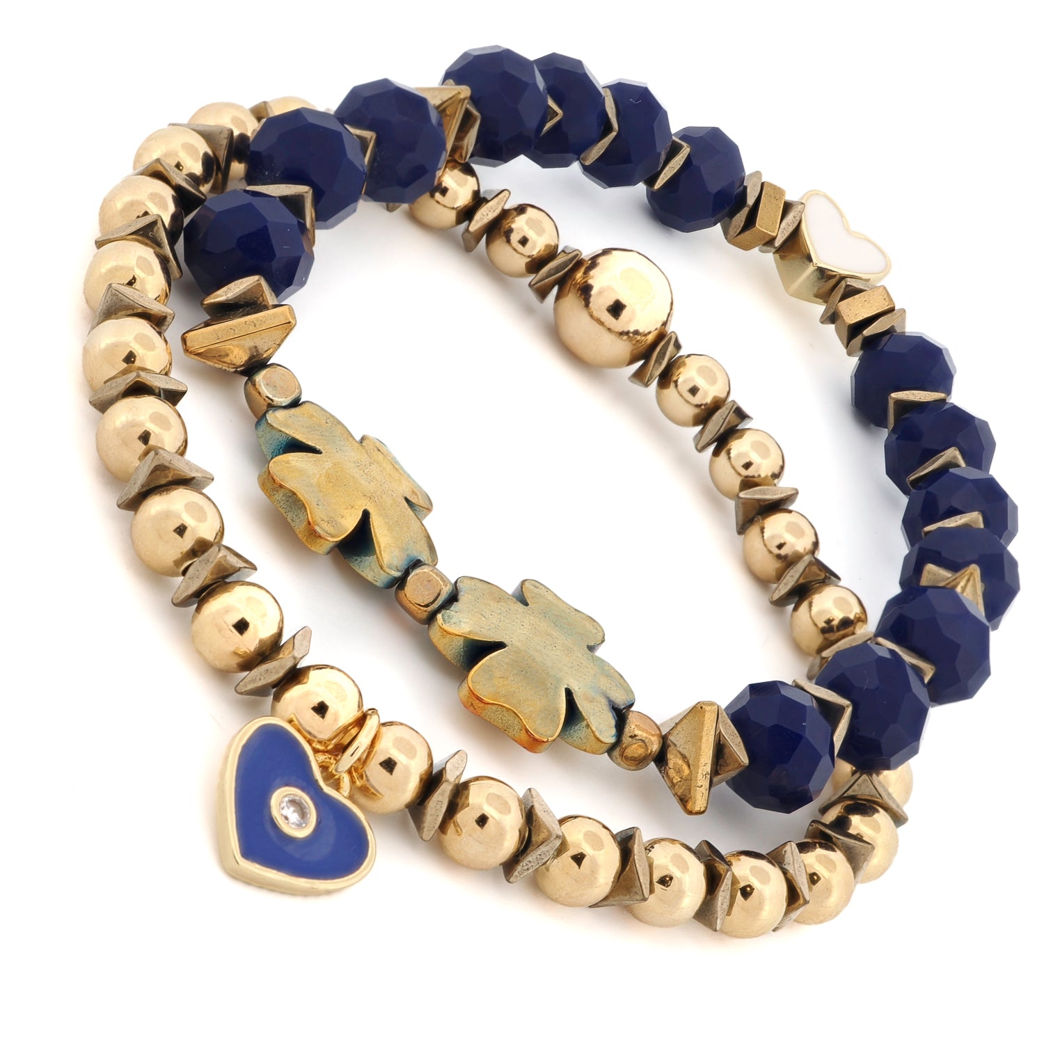 Close-up of white enamel heart bead and blue enamel heart charm with crystal center