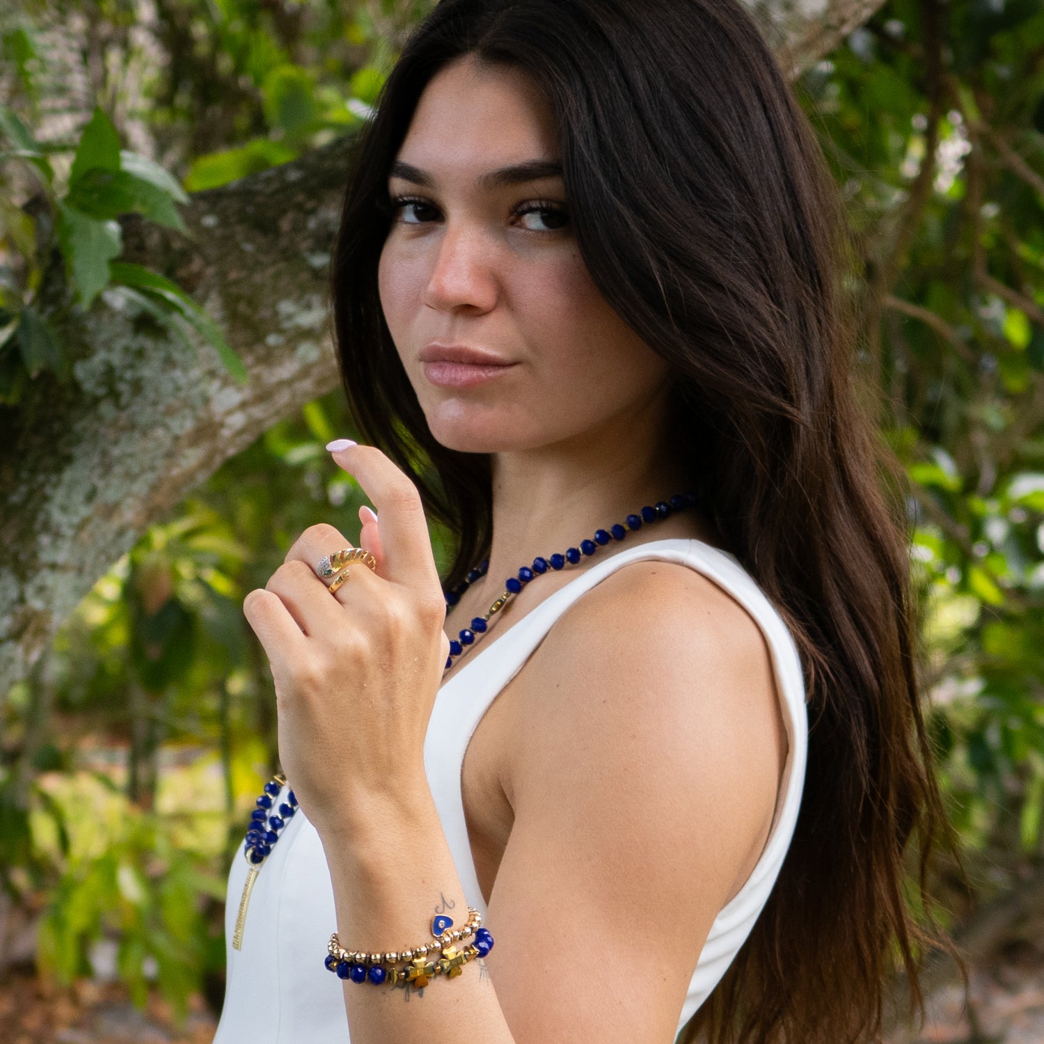 Stretch bracelet duo with 18K gold plated beads, blue crystals, and symbolic heart accents