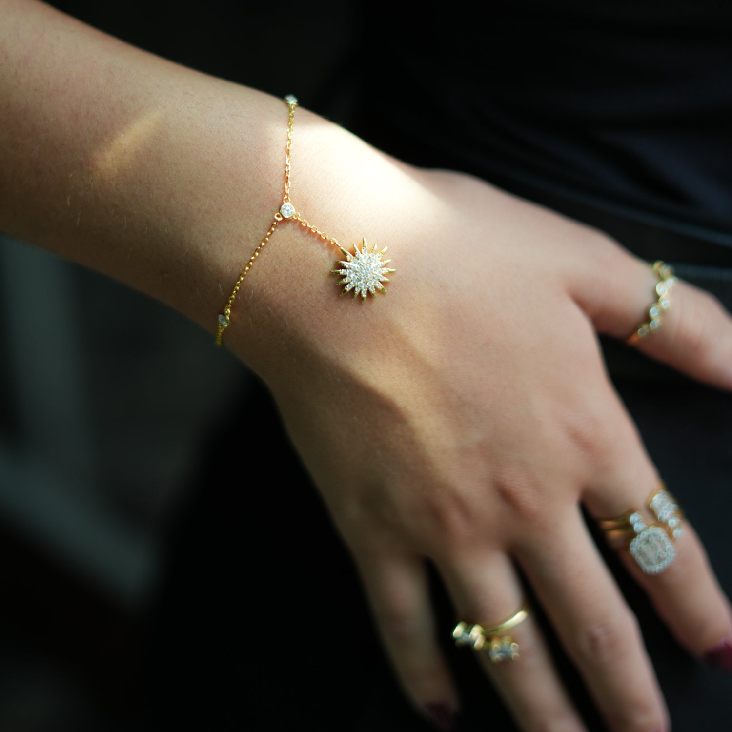 Gold Hand Bracelet with CZ Diamonds and Sun Pendant for a Stylish, Brilliant Fashion Statement