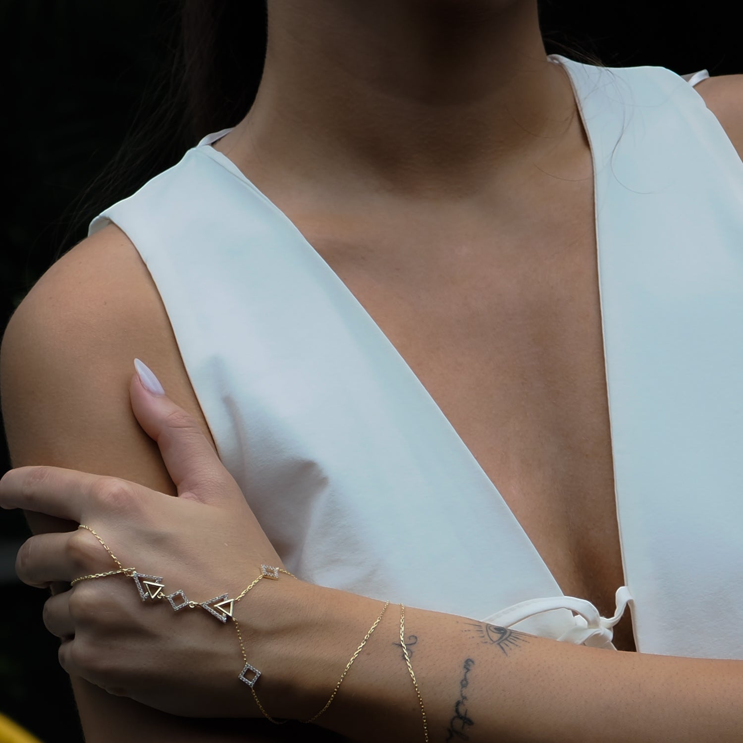 Stylish gold vermeil hand bracelet with a modern triangle design and Cz diamonds for a glamorous touch.