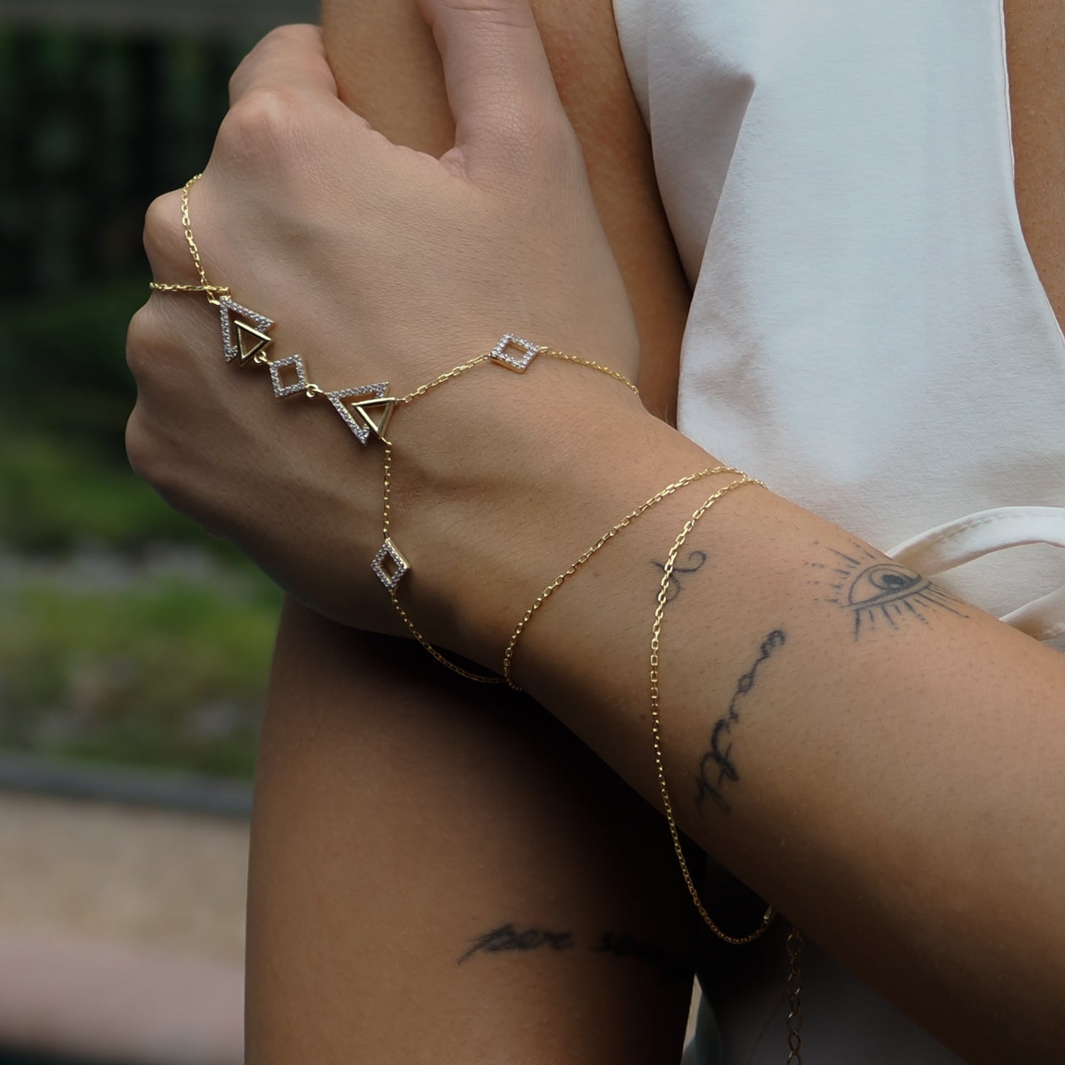 Diamond Triangle Hand Bracelet crafted from 18K gold-plated sterling silver with a chic, modern design.