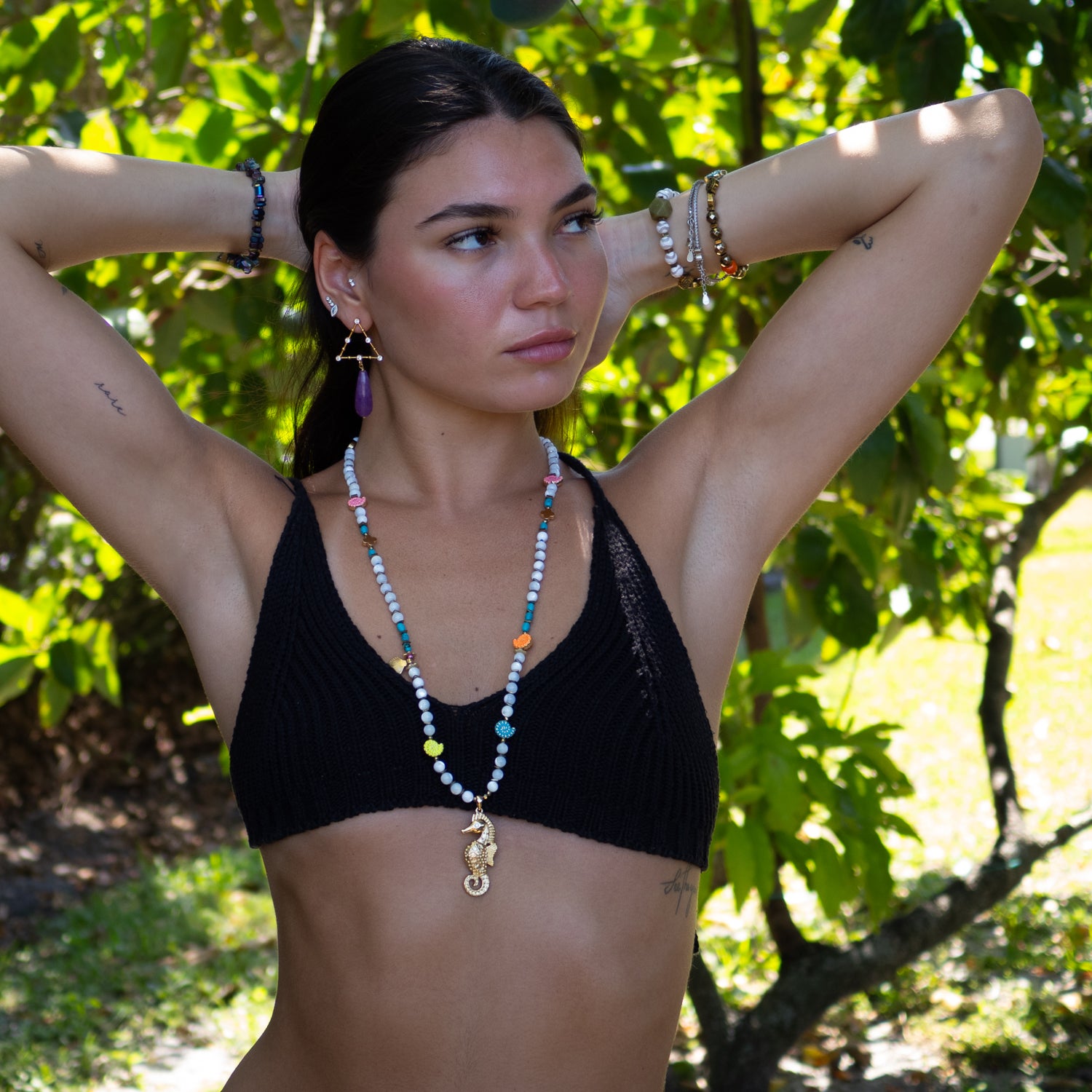 Boho-chic earrings combining mystic symbolism with radiant gold-plated detailing