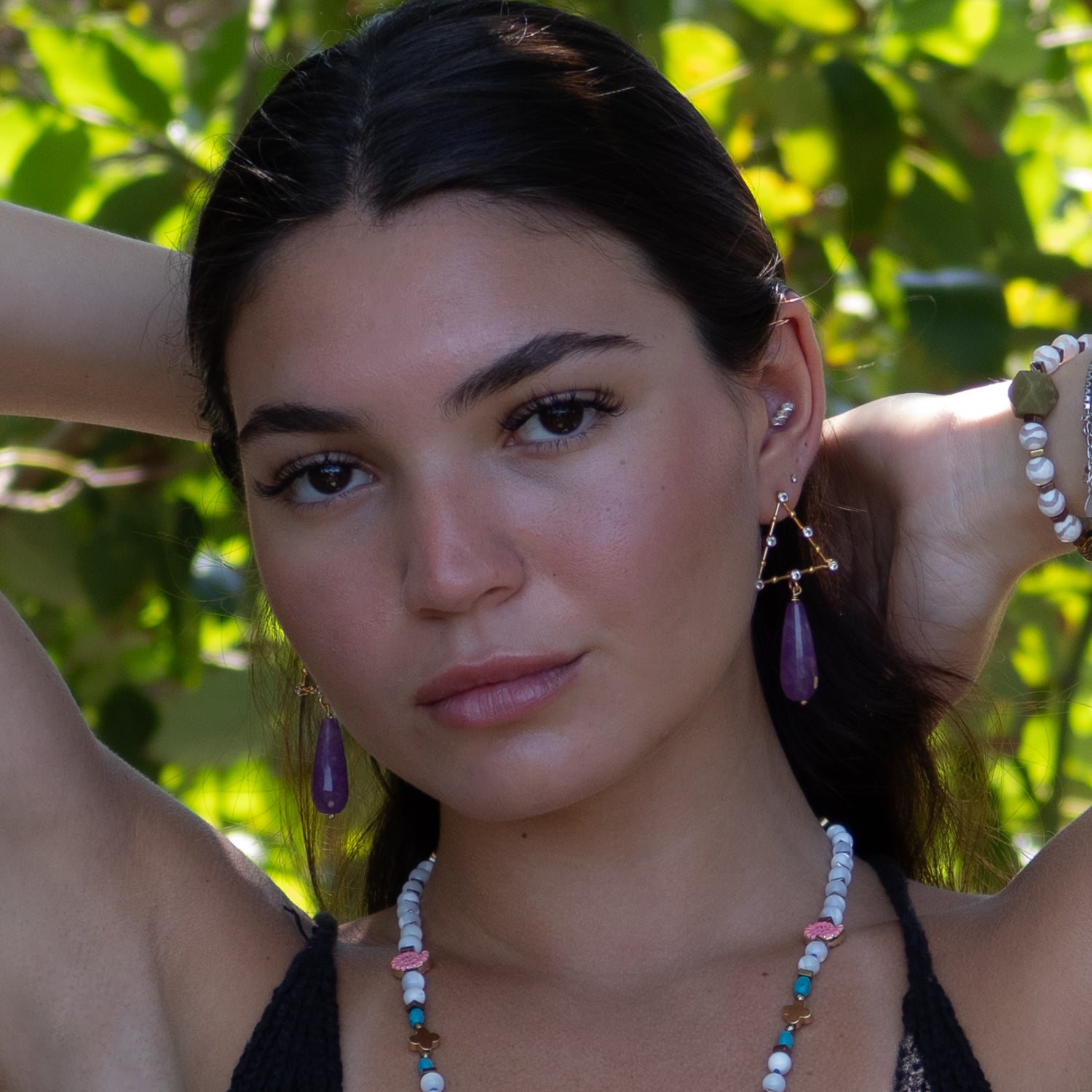 Handmade earrings with CZ-studded triangles and amethyst stones for spiritual elegance