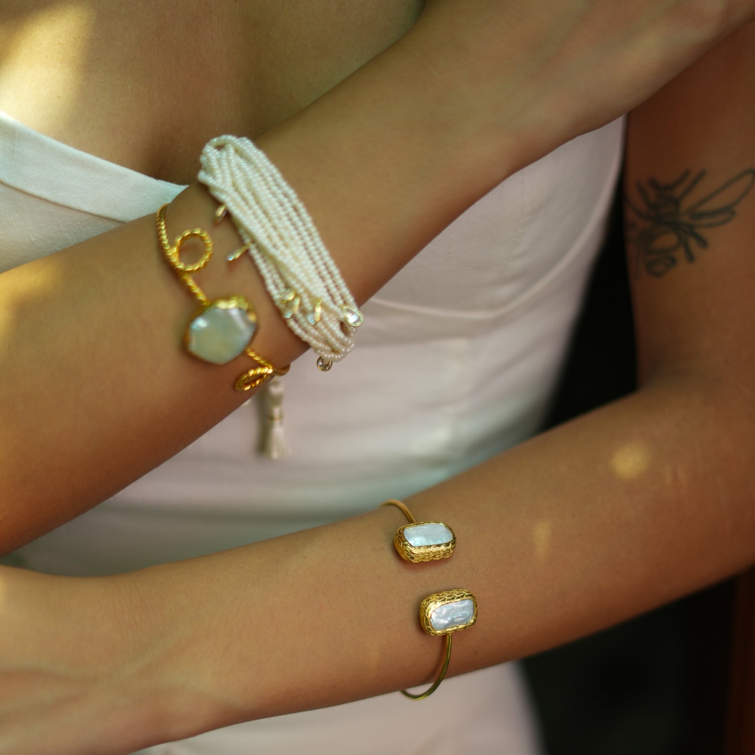 Gold Bangle with Rectangular Frames and Pearl Stones for a Bold, Timeless Statement