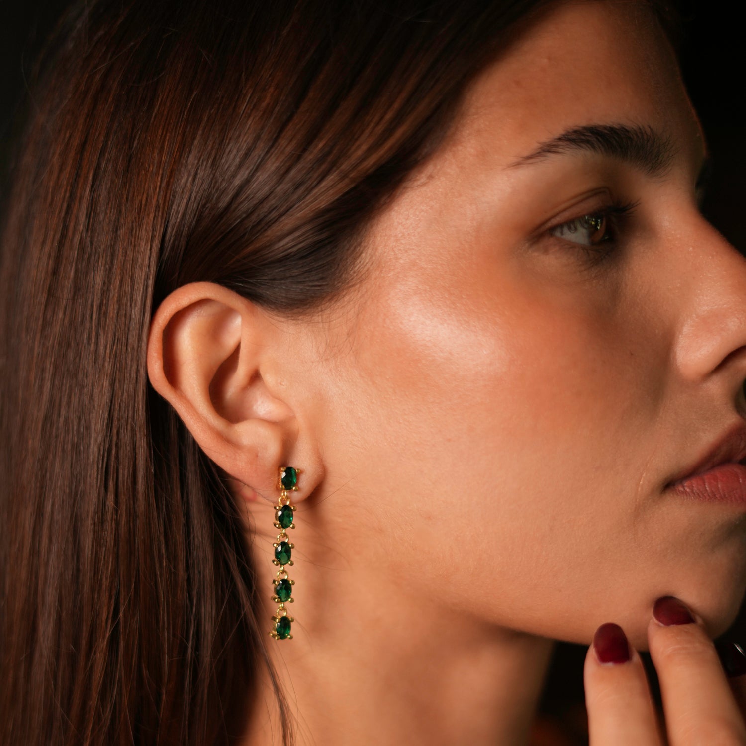 Sophisticated drop earrings with 24k gold-plated frames and emerald stones, designed to add a touch of sparkle and elegance.