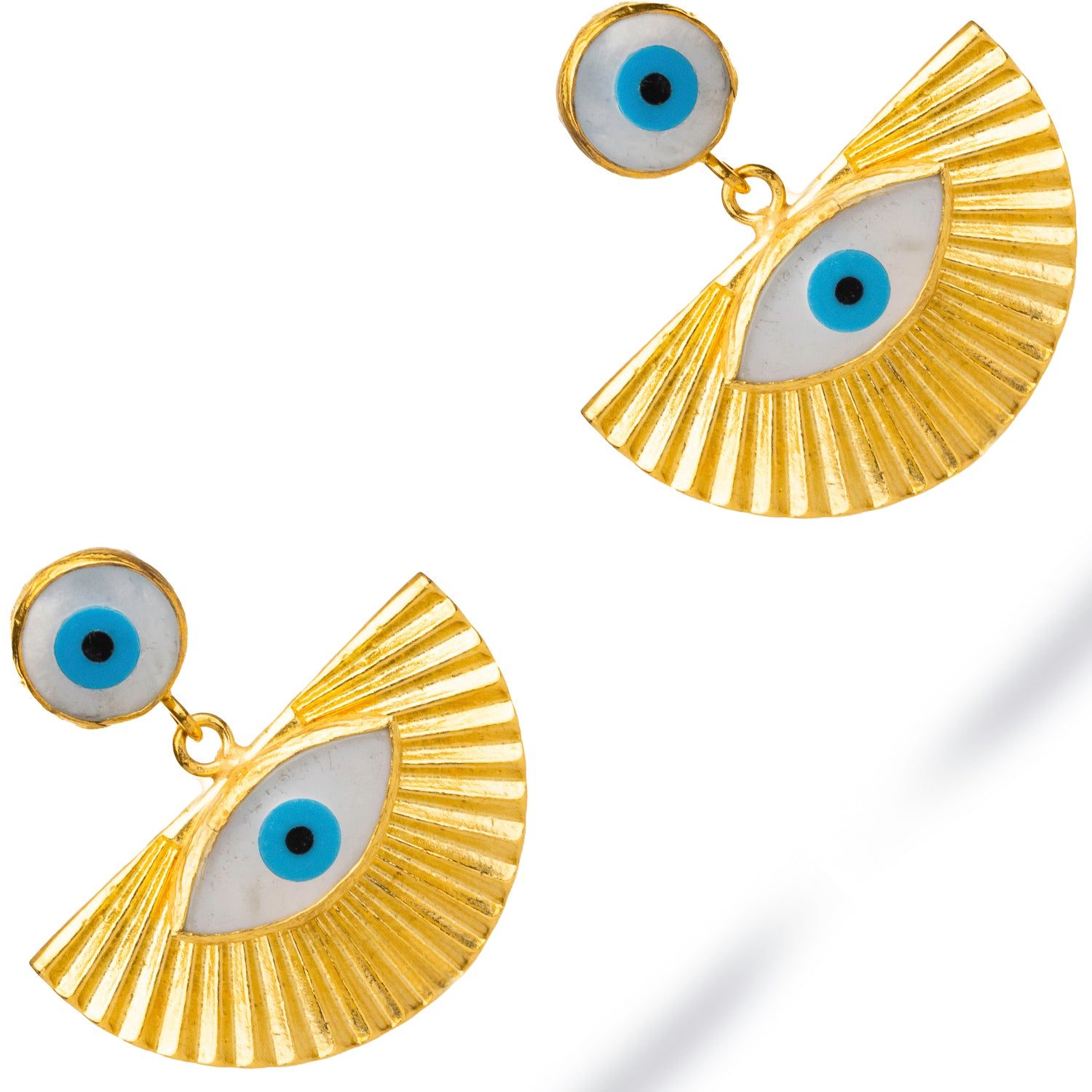 Chunky 24k gold earrings with dual evil eye motifs, combining blue enamel, pearls, and radiant sun-shaped accents.
