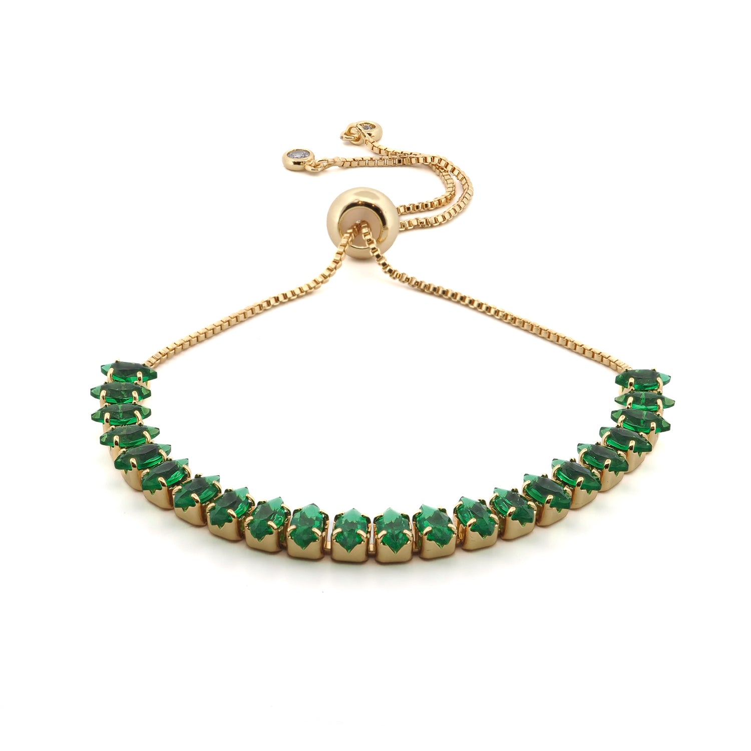 Emerald Glow adjustable gold bracelet with green emerald-cut stones on white background