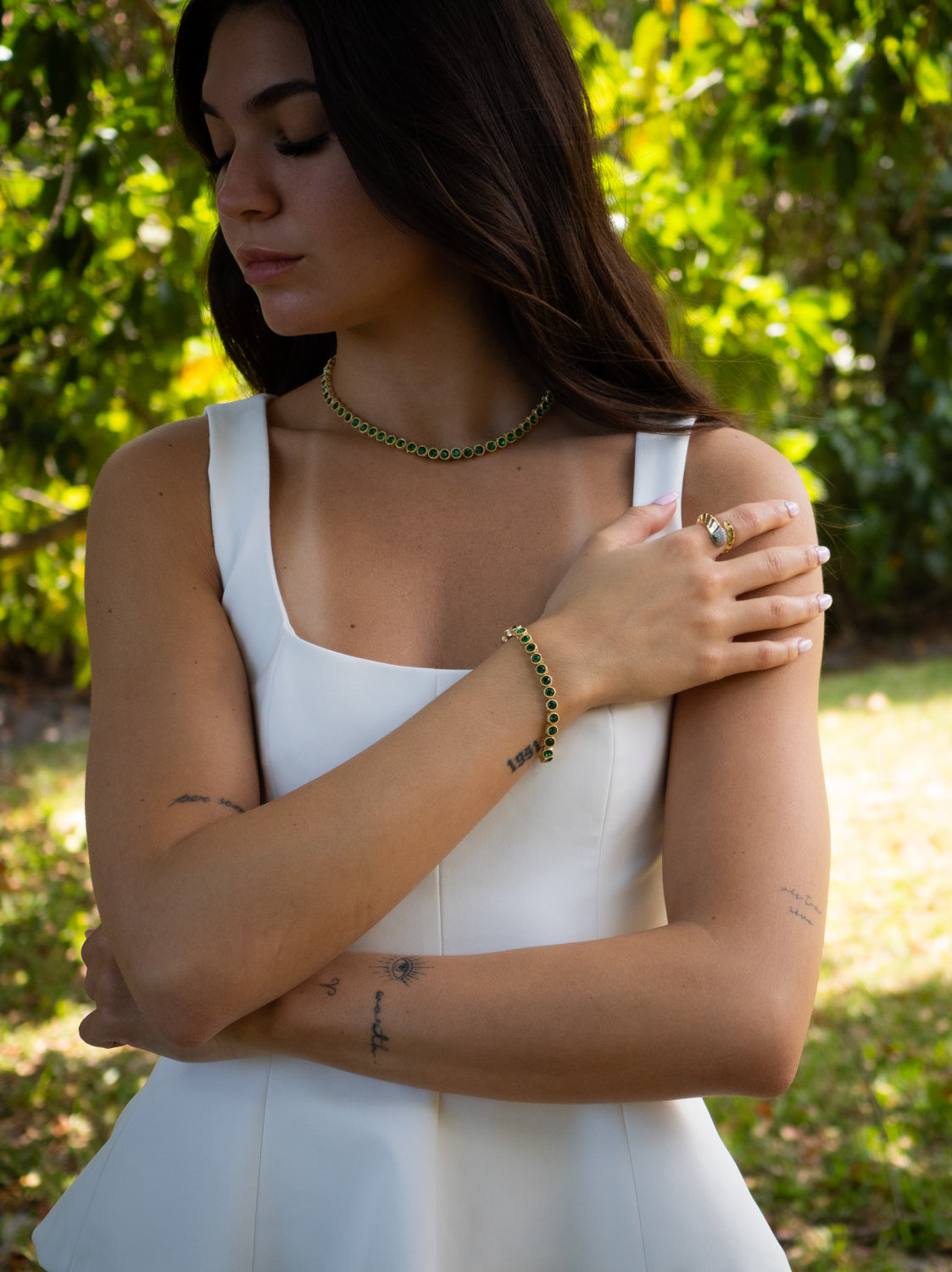 Emerald Tennis Bracelet with Gold-Plated Mystic Design, Symbolizing Renewal and Strength
