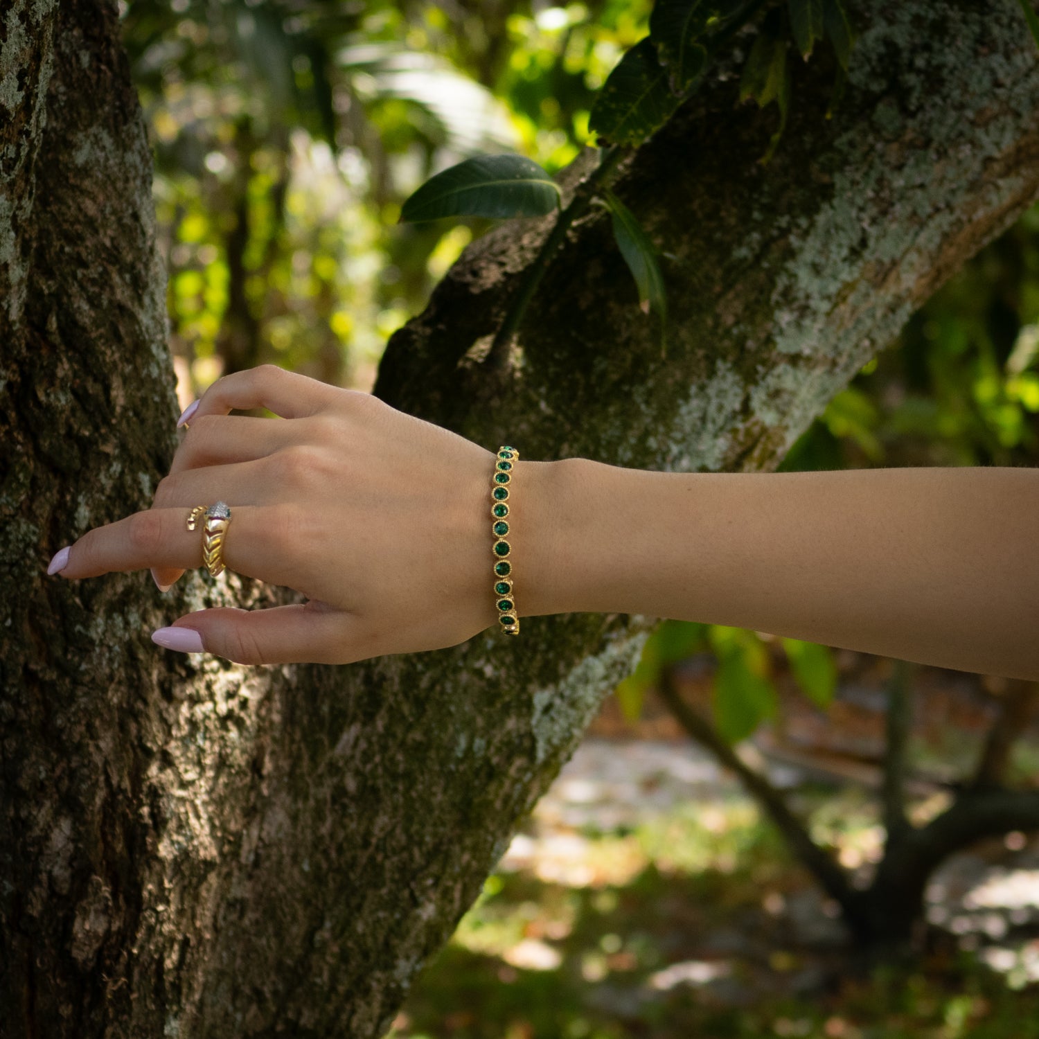 Stylish Emerald Tennis Bracelet with Gold-Plated Bronze Base, Featuring Spiritual Mystic Details