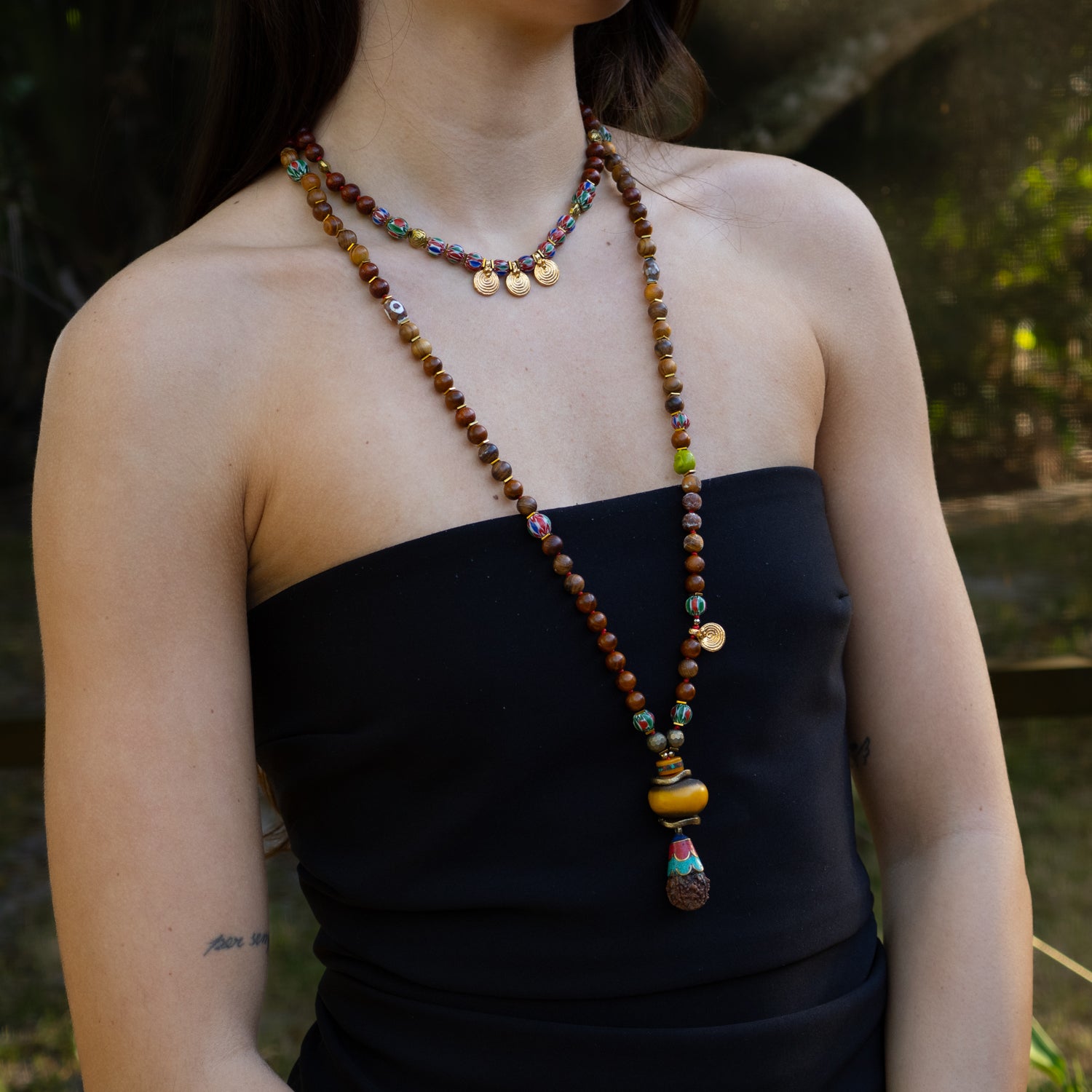 Gold Spiral Charm Beaded Necklace with African Beads and Wooden Elements for a Bold, Boho-Chic Look