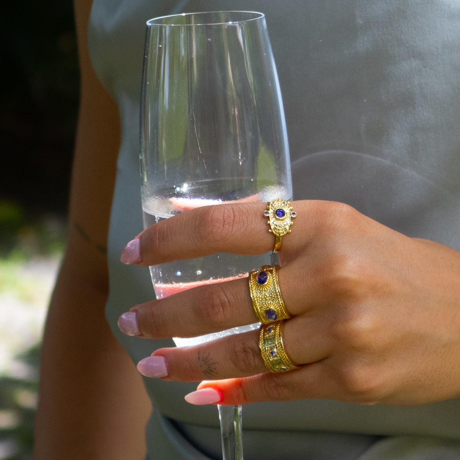 Handcrafted bronze ring plated in 24K gold featuring spiritual amethyst centerpiece.