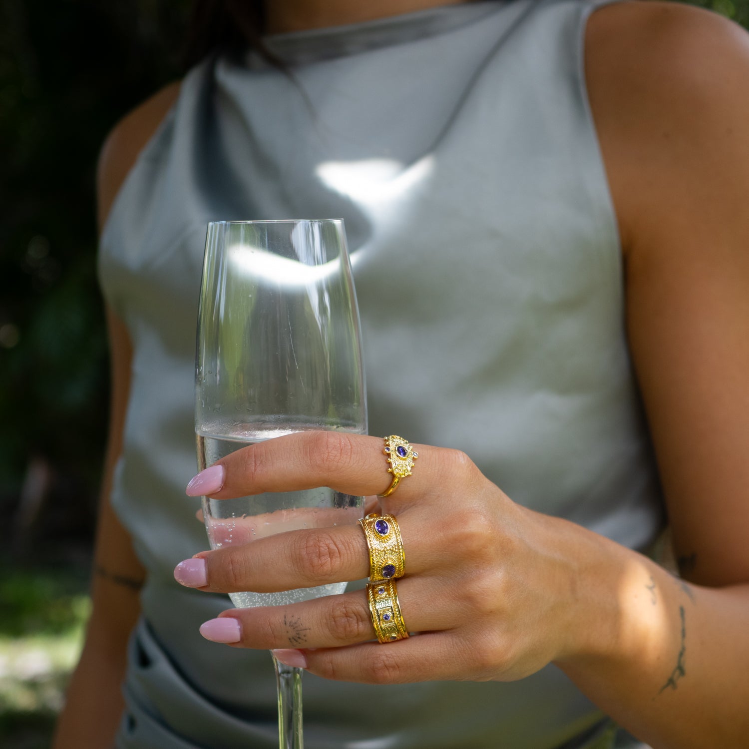 Close-up of luxurious gold ring with radiant amethyst symbolizing protection and inner peace.