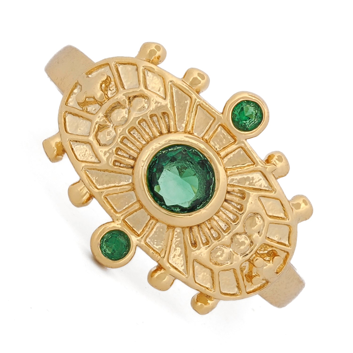 Artisan open ring showcasing detailed gold motifs and bold emerald at its center.