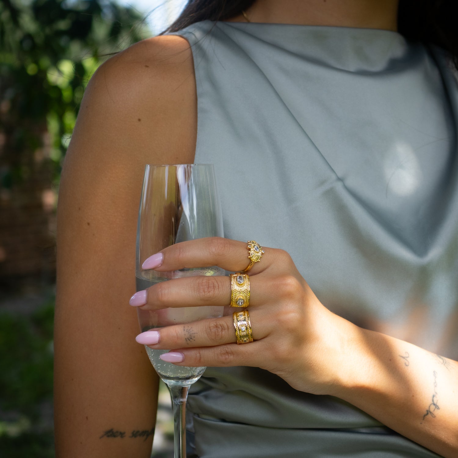 Statement ring blending rich 24K gold finish, diamond brilliance, and ancient Egyptian patterns.