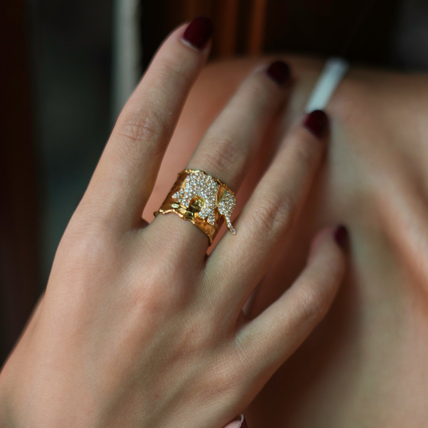 Gold chunky ring with a detailed CZ diamond elephant, designed for both style and protection, adjustable size for a custom fit.