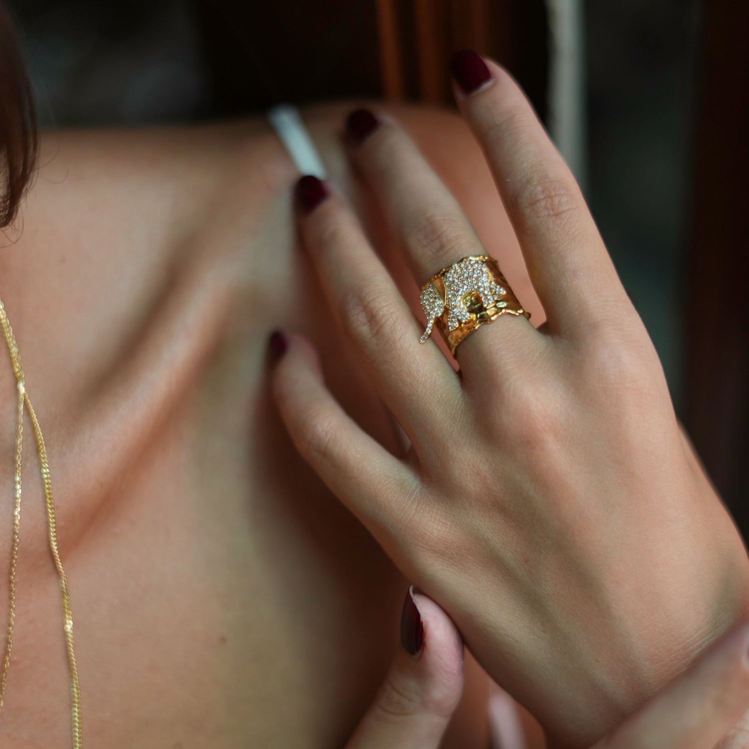 Sophisticated chunky ring featuring a diamond-studded gold elephant, crafted in 24k gold-plated brass, adjustable for any size.