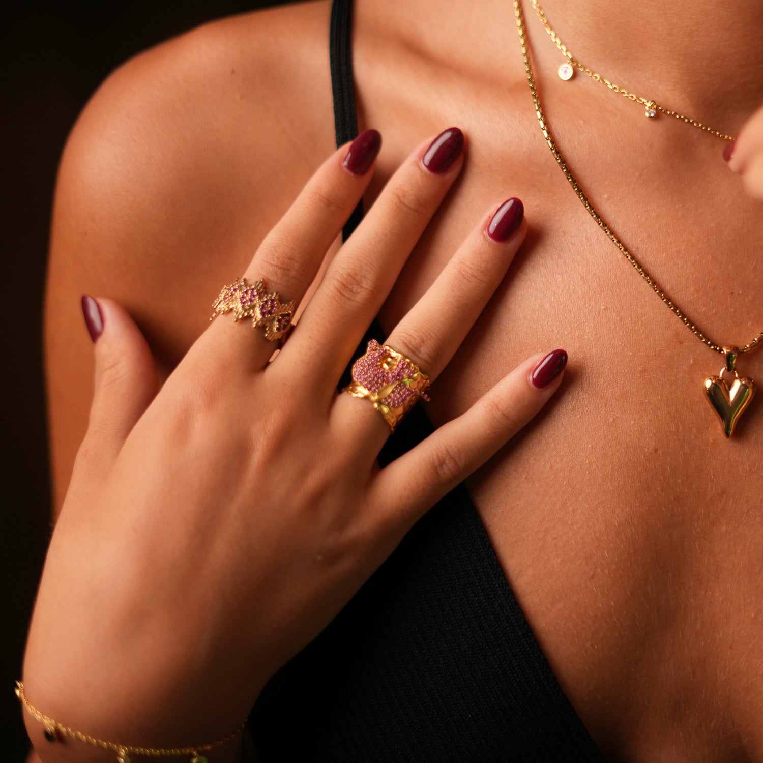 Bold ring with a pink Swarovski crystal elephant in a chunky gold setting, adjustable band for comfort and style.