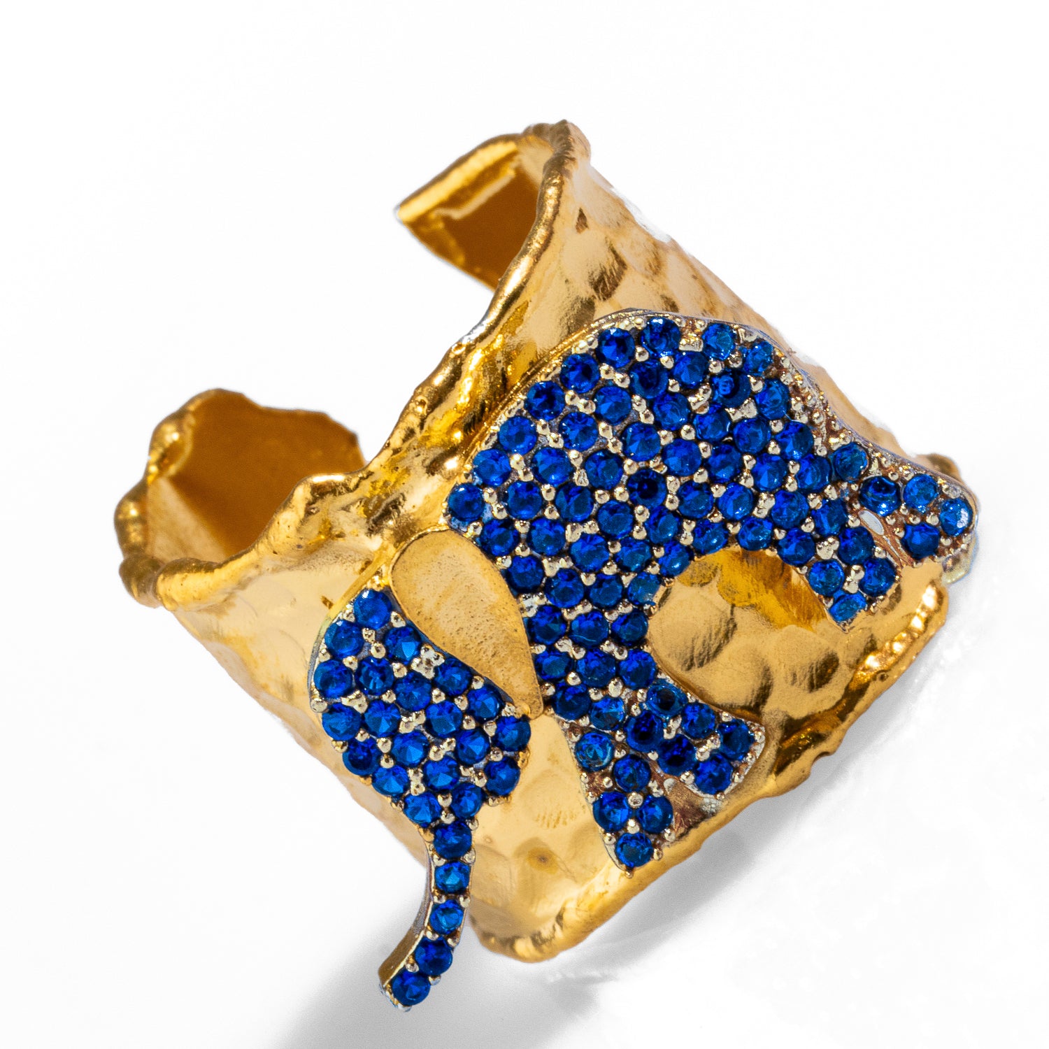 Luxurious 24k gold-plated ring with a sapphire crystal elephant, combining protection and elegance in an adjustable design.