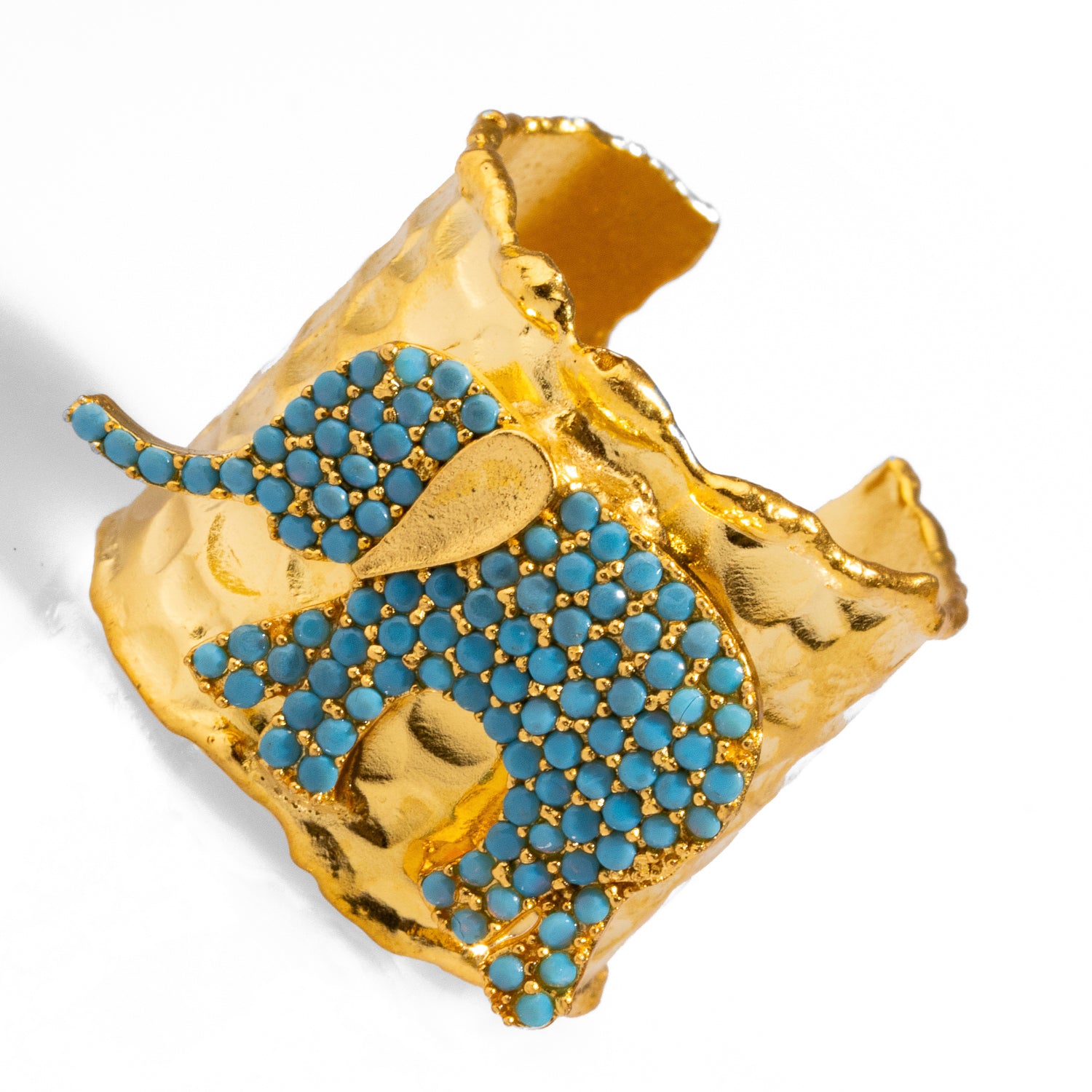 Striking 24k gold-plated ring with a turquoise elephant, combining bold design with spiritual symbolism, adjustable for versatile wear.