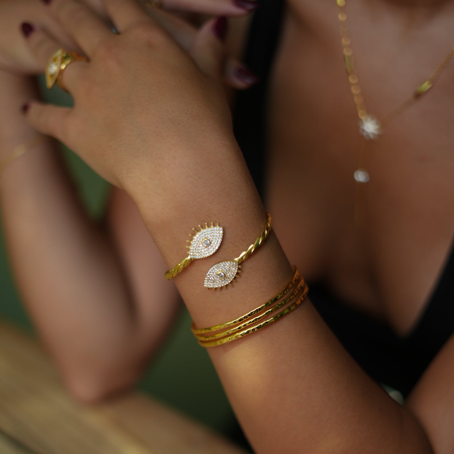 Diamond and Gold Evil Eye Cuff Bracelet with Twisted Design for Bold Fashion and Meaning
