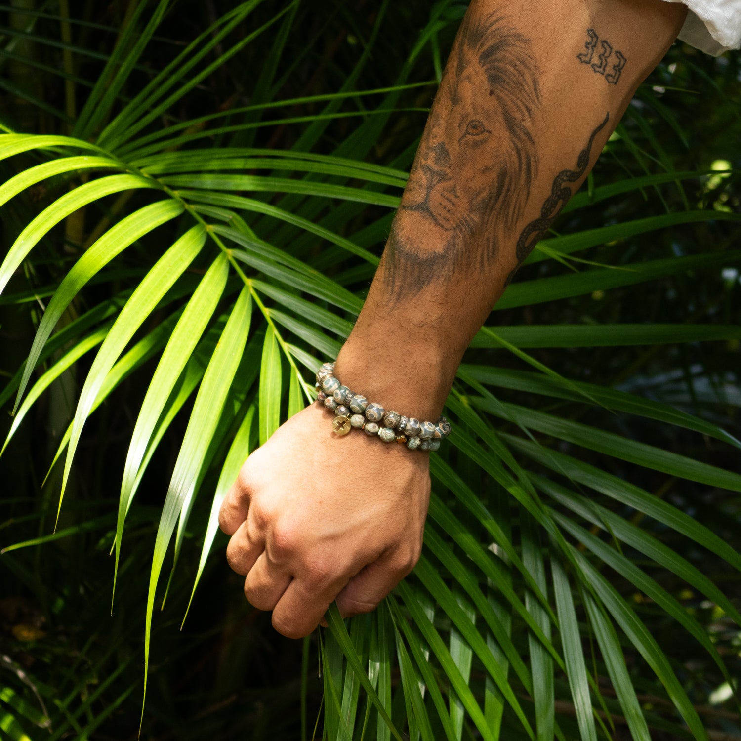 Unique beaded bracelet for men with diamond spacer and Nepal bead center.