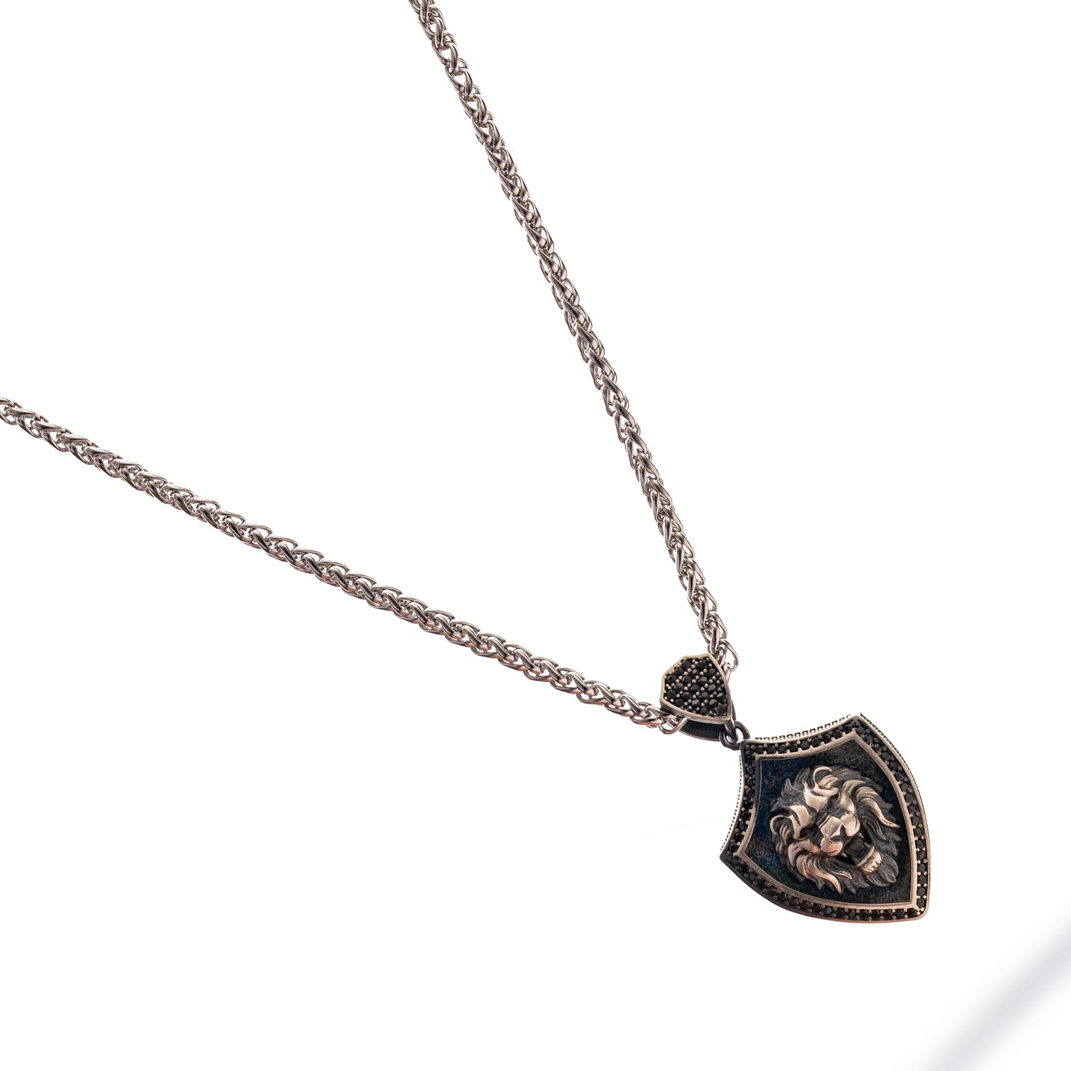 Sterling silver Lionheart Shield men's necklace with raised lion head shield pendant, rhodium plating, and a polished silver chain.