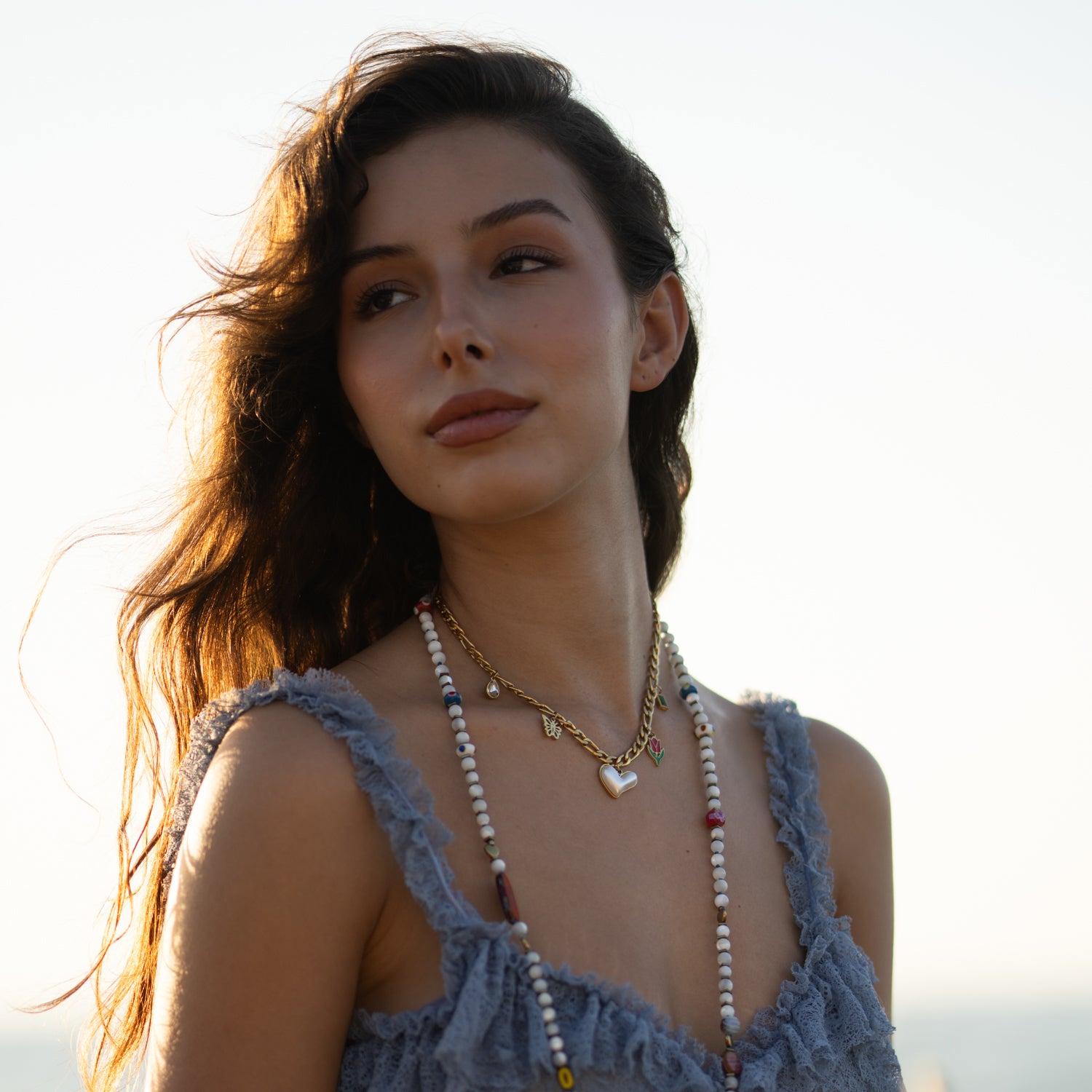 Playful gold necklace with butterfly and tulip charms, perfect gift for nature and flower lovers
