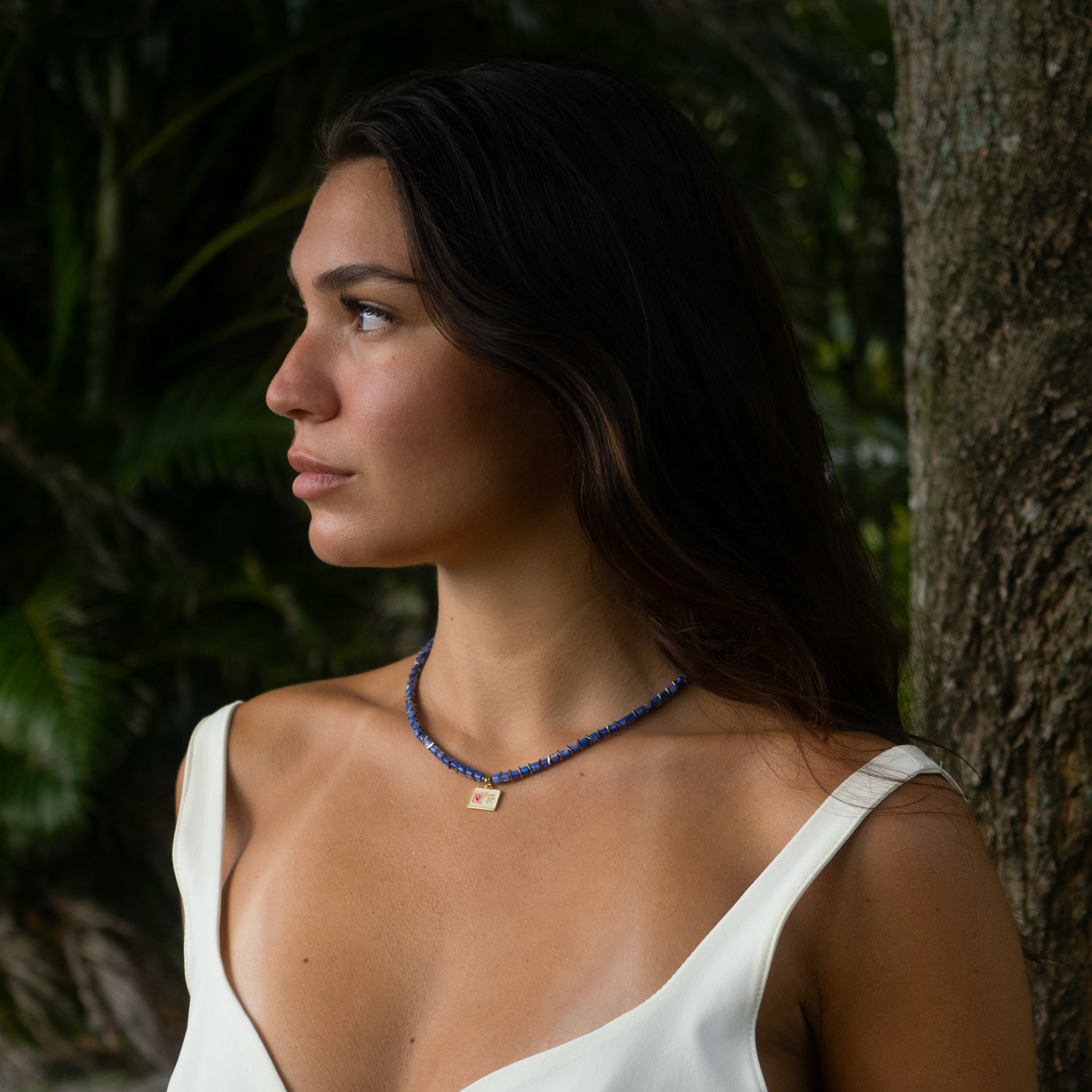 16-inch adjustable choker with enamel charm symbolizing affection and connection.