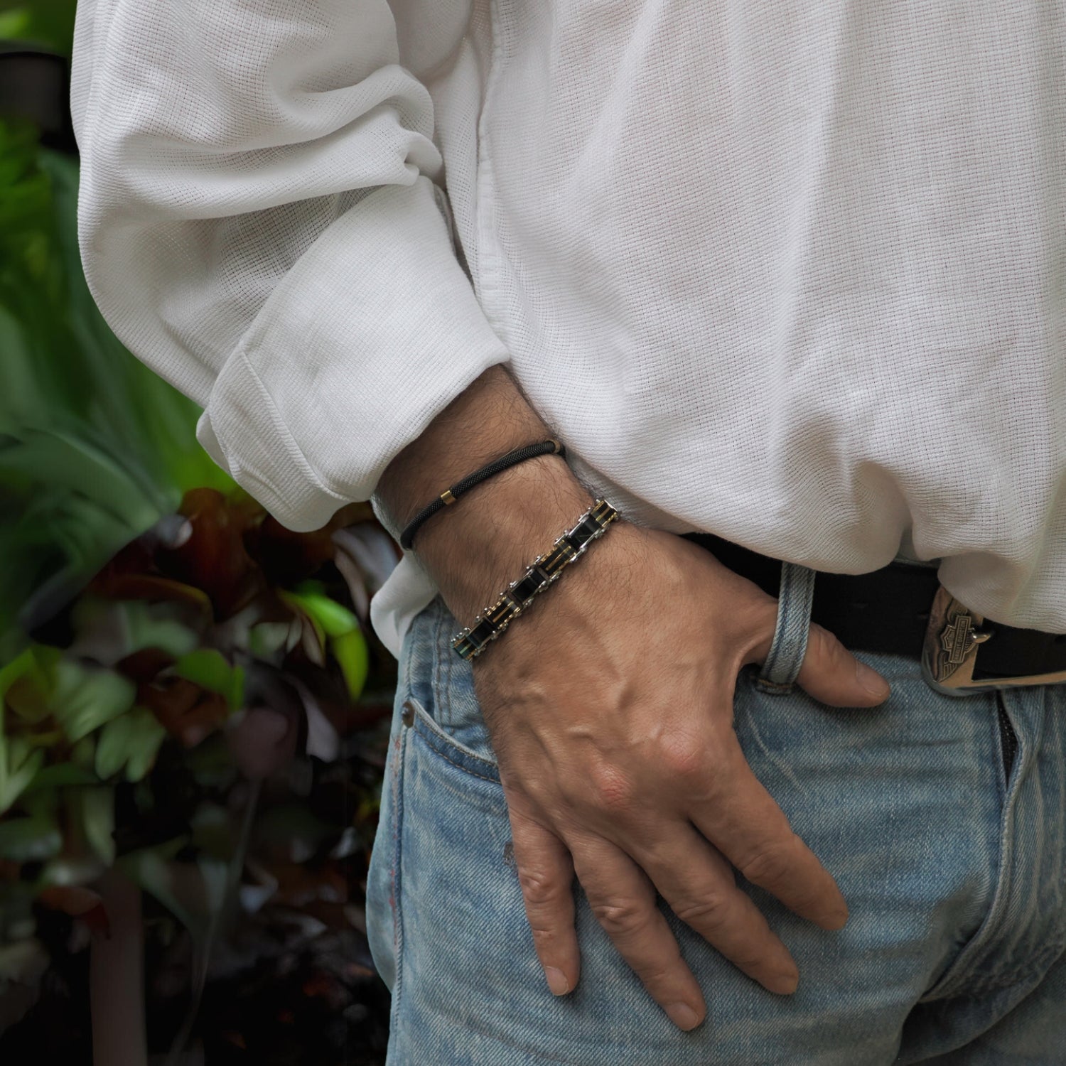 Refined bracelet for men with alternating black and gold-tone links, perfect for both formal and casual wear.