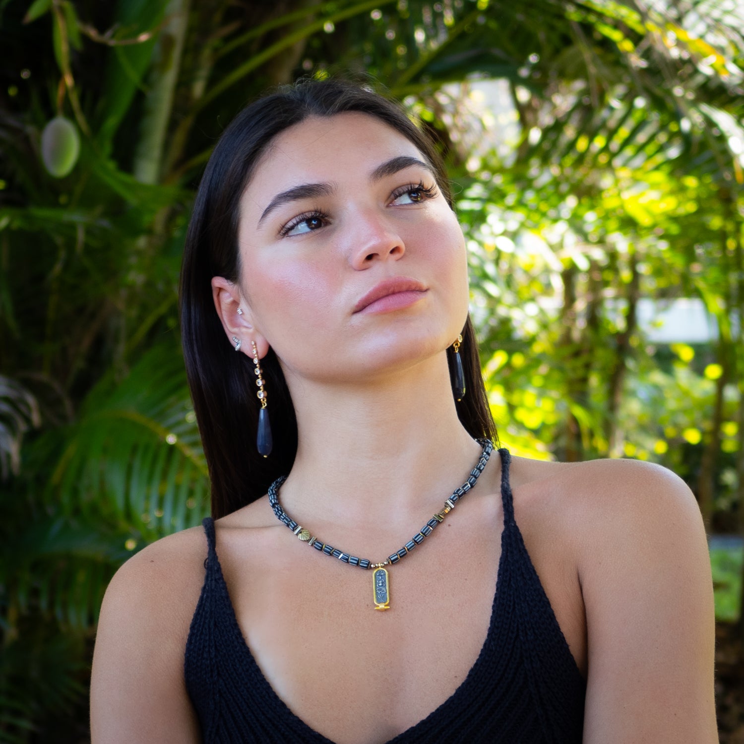 Push-back statement earrings with deep blue stones and radiant gold finish