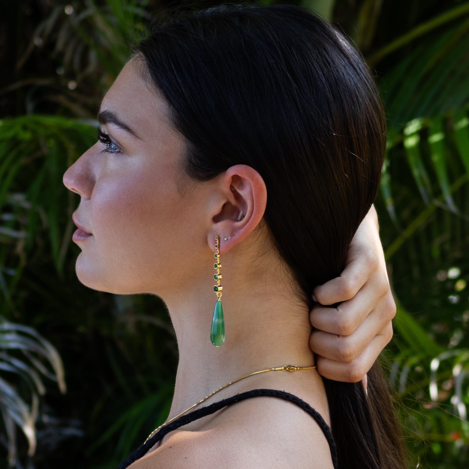 Green jade teardrop earrings symbolizing growth, renewal, and emotional healing