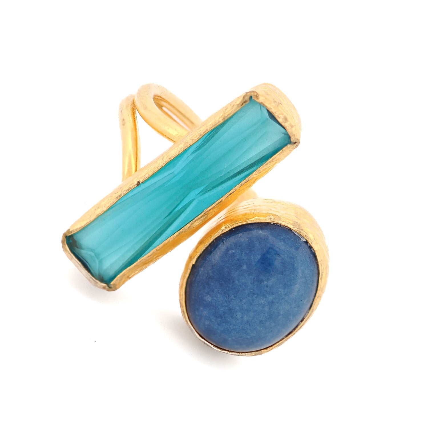 Close-up of 24K gold-plated bronze ring with contrasting gemstones for spiritual clarity