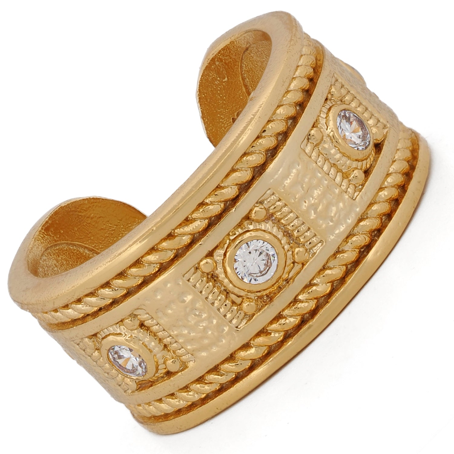 Elegant open cuff ring in gold with mystical patterns and radiant diamond accents.