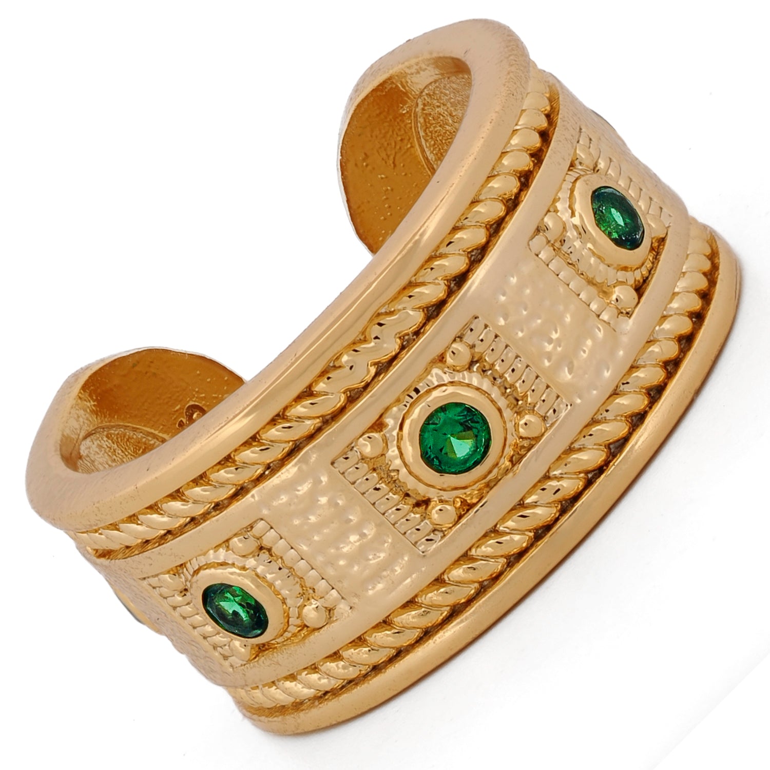 Artisan open cuff ring showcasing deep green emeralds and powerful mystical details.